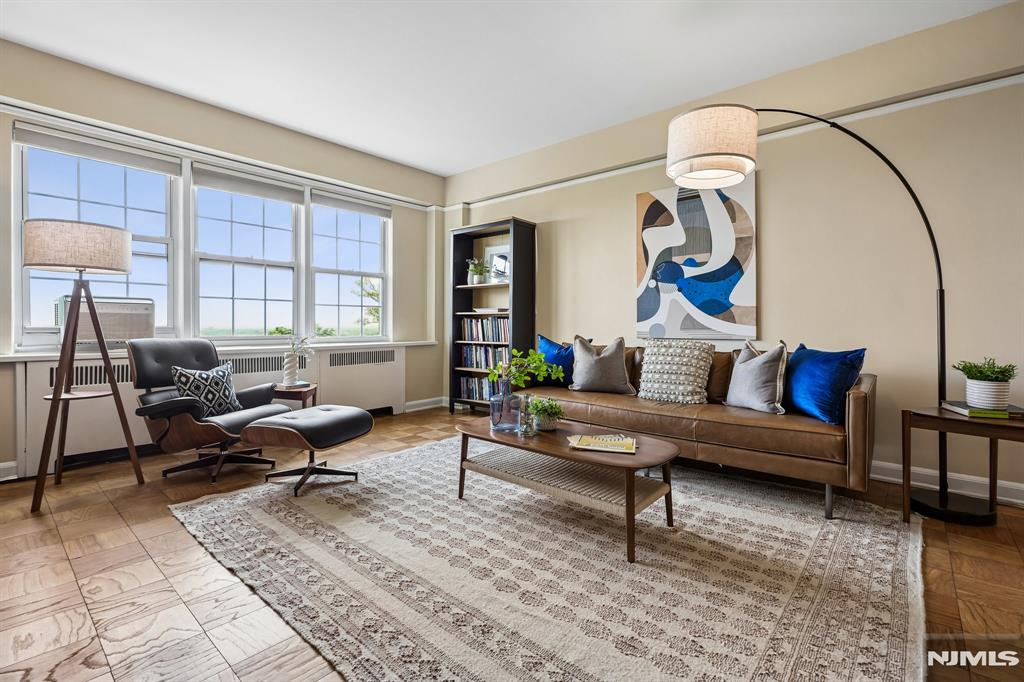 Discerning lifestyle at The Rockcliffe in Montclair, a perfect alternative to the high costs of Manhattan, while retaining an iconic feel! This pre-war building showcases a sun-filled one-bedroom co-op, boasting high ceilings, picture moldings, and parquet floors. The 2024 kitchen renovation includes quartz countertops, hardwood cabinets, s/s appliances, and an LG washer and dryer. The apartment includes three Midea AC window units. Manhattan skyline views year-round from both the living room and bedroom. Located at the top of First Mountain in a park-like setting, close to downtown Montclair with shopping, restaurants, an art museum, movie theaters & NYC transportation. The fee of $1,311.15 includes heat, hot water, gas, sewer, trash, 24-hour front desk, on-site super, common area maintenance, and property taxes - 37% tax deductible. Unit 5J is 378 shares. Welcome home!