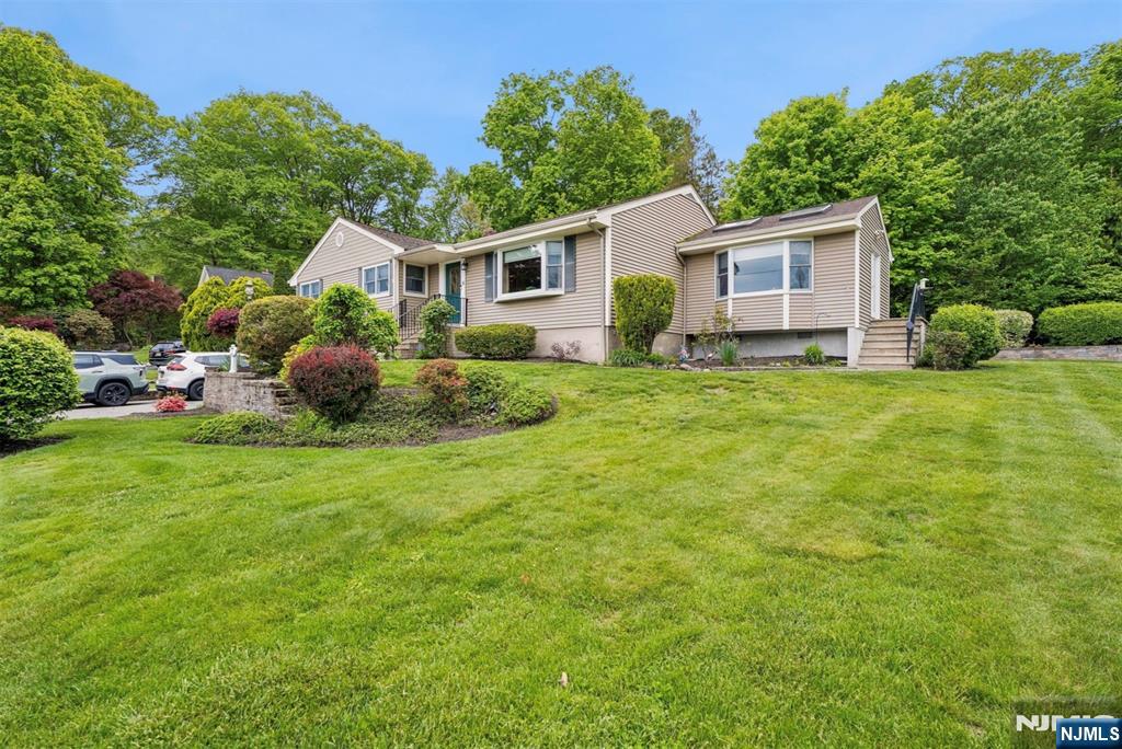 Welcome home and welcome to a slice of paradise. Feel like you're on vacation every day in this beautifully maintained 3 bedroom (possible 4th bedroom) 2 full bath home that has been meticulously cared for and holds years of memories. With spectacular lake views and located on a cul de sac this is a one in a million find in beautiful Fayson Lakes. Large living room, separate formal dining room, large eat in kitchen, bonus room with double doors off of the dining room, this is your first and last stop. Main bath and 3 bedrooms on the first level, 2 large rooms on the lower level with possible 4th bedroom, office/den and full bath, entrance to garage, workshop and laundry room. Beautifully landscaped property and did we mention THOSE VIEWS? Get ready to unpack. This home has held countless years of happiness and memories and now it's time for new owners to make their own, all while enjoying all that Fayson Lakes has to offer. Beaches, swim club, clubhouse, tennis, volleyball on the beach, fishing, boating and a community that once you're here, you don't want to leave. All of this plus Kinnelon's top rated school system, close to transportation, 30 minutes from NYC, close to county parks, golf courses and restaurants. MAKE THIS YOUR FIRST AND LAST STOP. WELCOME HOME!