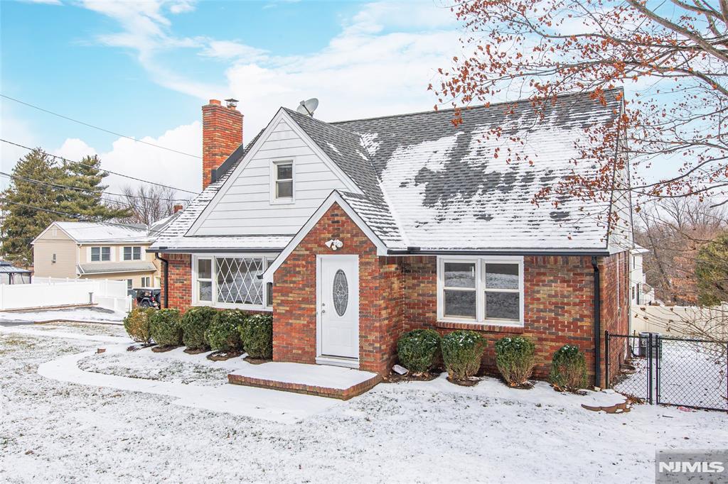 YOUR SEARCH ENDS HERE! Charming multi-generational Cape-style home situated on a desirable corner lot with a large fenced-in backyard. This 4-bedroom, 2-bathroom home offers plenty of space and versatility! The first floor features a cozy living room, two bedrooms, a full bath, and a lovely screened-in porch perfect for relaxing. Upstairs, you'll find two additional bedrooms, another full bath, and a kitchen ideal for a in-law suite setup, which can easily be converted into a laundry area or a spacious walk-in closet. Additional highlights include a one-car attached garage and a full, partially finished basement with a rec room and ample storage. Located in a top-rated school district. Don't miss this incredible opportunity!