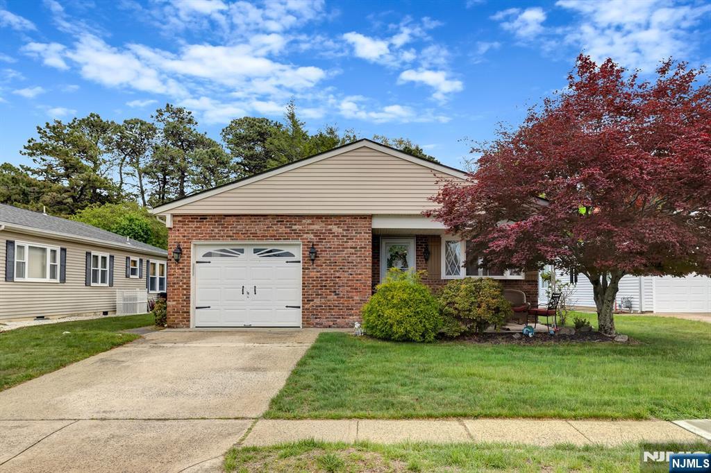 Welcome to Holiday City West in Toms River! This inviting ranch home offers comfortable one-floor living with an open layout, spacious living and dining areas, breakfast nook, covered front porch, and attached garage with direct entry. The generously sized primary suite provides comfort and privacy. Step outside to a private backyard backing to a peaceful wooded area with a patio just off the kitchen, perfect for relaxing and entertaining. The serene setting allows nature to become part of everyday life, with frequent visits from local wildlife adding to the charm. Holiday City West offers a clubhouse, pool, tennis, bocce, fitness center, and many social activities, all conveniently located near shopping, restaurants, and the Community Hospital.