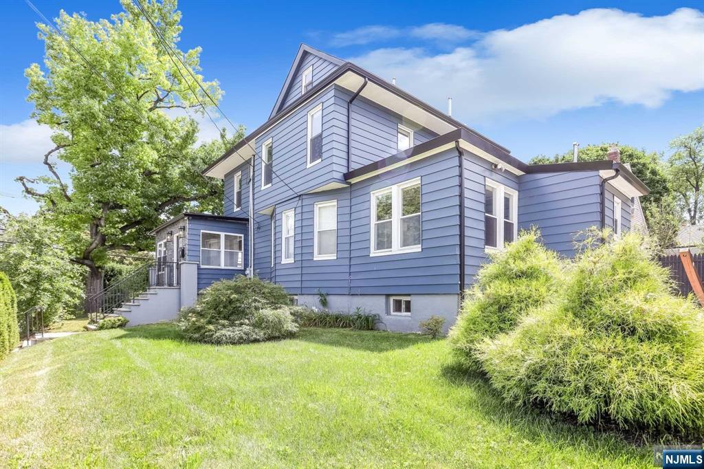 This spacious home is beautifully renovated offering an open, bright, and airy floor plan. Enjoy 4 true levels of finished living space from the basement up to the attic, including a bedroom & full bathroom on the main level. An ideal and flexible arrangement for extended family and guests. 2 zone HVAC w/ smart thermostats, ample closets throughout, large 2 car garage, private patio areas, and plenty of room to entertain, make this home an exceptional value. Quiet residential location with an easy commute into NYC and conveniently located near parks, shopping, and major highways. Home being sold in "As-is" condition (1st floor central air unit is not working). Seller holds a NJ real estate license. Listed by Tovah Yucht (201-981-7204 / Tovah@WeinAgency.com).