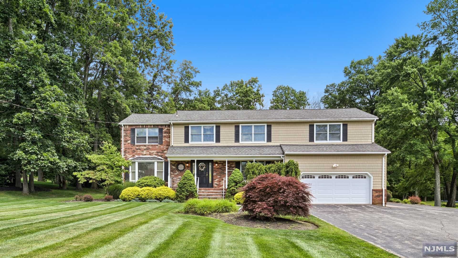 Welcome to the coveted community of Pompton Plains. Situated on this sprawling lot awaits a gorgeous Colonial boasting nearly 4,000 sf of living space PLUS the large finished basement. Live & entertain freely as this pristine, expanded residence offers an artful blend of cozy charm w/today's desirable updates. Entertain the largest of crowds from the heart of the home in the most luxurious of kitchens complete w/ a massive center island, high end appliances, gorgeous granite tops plus a sun drenched eating area. Other 1st floor features include: Formal DR, Palatial Family Rm w/custom built-ins, gas fireplace, private Living Rm, powder rm, mud rm & laundry rm. The 2nd floor will amaze you as it encompasses SIX SPACIOUS BEDROOMS, 3 full bathrms & tons of closets! The basement offers plenty of rec space and can be the perfect place for an in-law suite including multiple rooms, workshop/wine cellar w/outside entrance and full bathroom! Schedule your private tour today.
