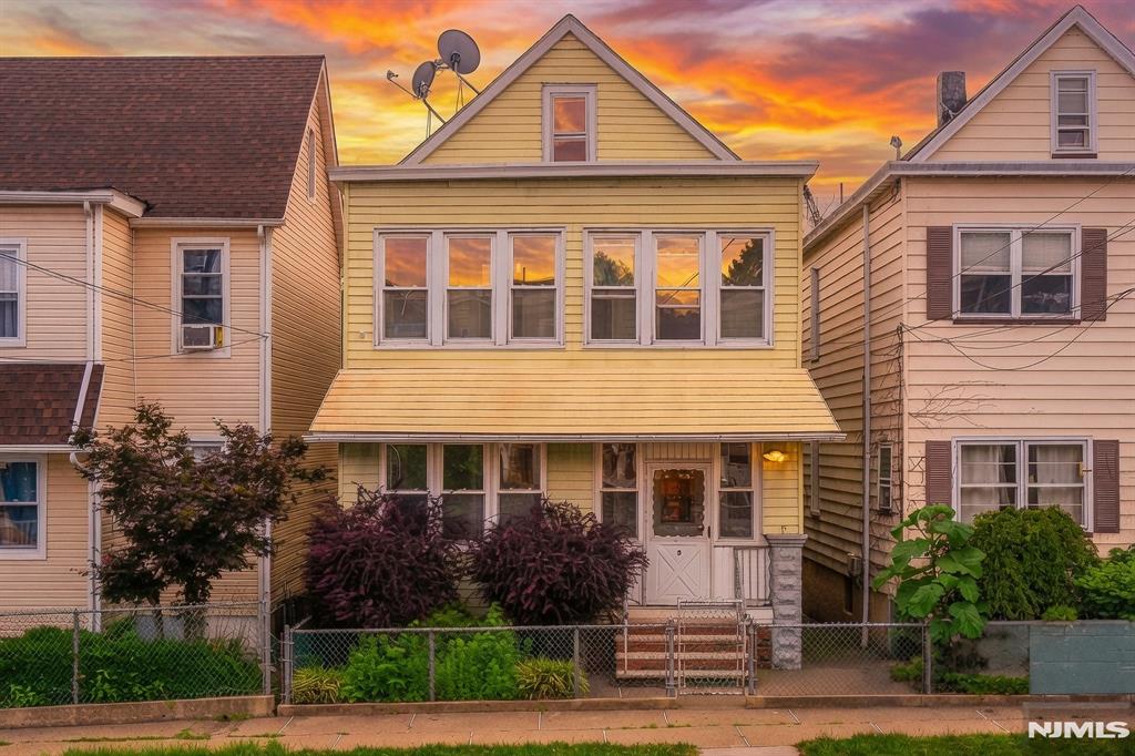 LOVELY & BRIGHT, WELL MAINTAINED 2 FAMILY HOME CONVENIENTLY LOCATED NEAR NYC TRAIN & BUS ACCESS. EXPERIENCE THE NICE KITCHENS, BATHROOMS & SPACIOUS LIVING ROOMS. BOTH FLOORS ARE IDENTICAL OFFERING LR, DR, KIT, 2 BRM & FBATH. PORCHES ARE ENCLOSED & USED FOR STORAGE. FULL, UNFINISHED BASEMENT W/LAUNDRY, UTILITY ROOM & GROUND LEVEL ACCESS IS PERFECT FOR ADDITIONAL STORAGE. SEPARATE UTILITIES, NEWER FURNACES, 100 AMP ELECTRICAL PANELS & MORE. THE FENCED-IN BACKYARD IS GREAT FOR ENTERTAINMENT OR OUTDOOR RELAXING. THE REAL ESTATE TAX IS ONLY $6,697. STREET PARKING ONLY. THIS TRULY IS A GREAT & AFFORDABLE HOUSE FOR A 1ST TIME BUYER, AN INVESTOR OR 1031 EXCHANGE. NOT A DRIVE-BY. MUST BE SEEN!