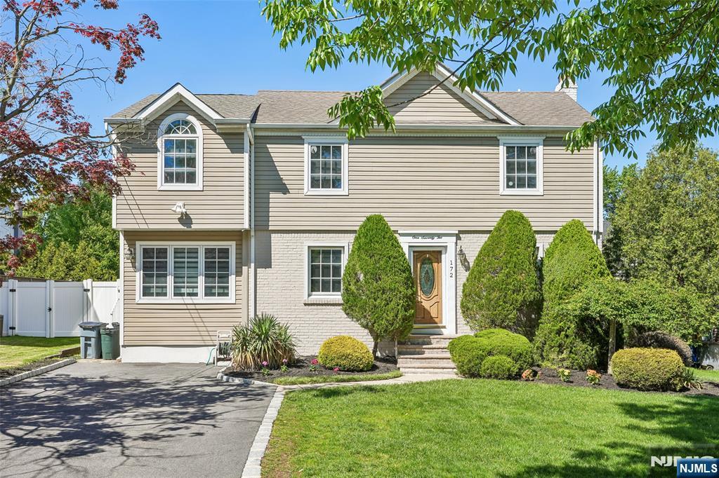 Well maintained beautiful center hall colonial on a quiet, sought-after River Edge street. The main floor features a bright living room, office, modern eat-in kitchen, dining room, stunning family room with high ceilings and sliding patio doors to a deck, perfect for entertaining. Includes a full bath & powder room. The upper level features a primary suite with a full bath plus 3 additional bedrooms and a full bath with a separate tub & shower. The full finished basement offers a massive playroom with high ceilings, a walk-in cedar closet, a second office & utility room with plenty of storage. In true move-in ready condition, this 4 bedroom, 3.5 bathroom gem offers the space you need.