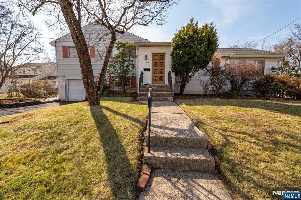 This wonderful four-bedroom split is ideally located in the northeast corner of Dumont. The home offers an inviting entrance foyer, eat-in kitchen, dining room, living room, family room, two full baths, and one half bath. Bright, spacious interiors provide flexible living and the option for comfortable single-level living. An attached one-car garage with two additional parking spaces adds convenience. Ideally situated close to transportation, shopping, schools, and recreational amenities, this home truly has it all. This home is being sold as is. Call Stephen O'Neill at 201-446-1228 with any questions ALL OFFERS DUE BY 9:00AM WEDNESDAY 04/01/2026