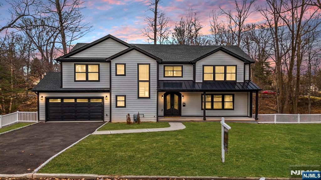 Experience luxury living in this stunning new construction home, perfectly situated in the sought-after Sleepy Hollow section of Plainfield. Boasting 5 bedrooms and 4.2 baths, this home features a chef's gourmet kitchen with quartz countertops, high-end stainless steel appliances, and a center island with seating for five. The spacious family room with a gas fireplace flows seamlessly into the formal living and dining areas, highlighted by elegant custom trim work. A powder room and a two-car built-in garage complete the first floor. Upstairs, the grand primary suite offers soaring ceilings, two oversized walk-in closets, and a spa-like ensuite bath. Three additional bedrooms, including one with an ensuite, plus a full hall bath and laundry room, complete the second floor. The finished walkout lower level features a fifth bedroom, recreation room, exercise/playroom, full bath, and a second laundry room. Conveniently located near NYC transportation, shopping, and major highways.