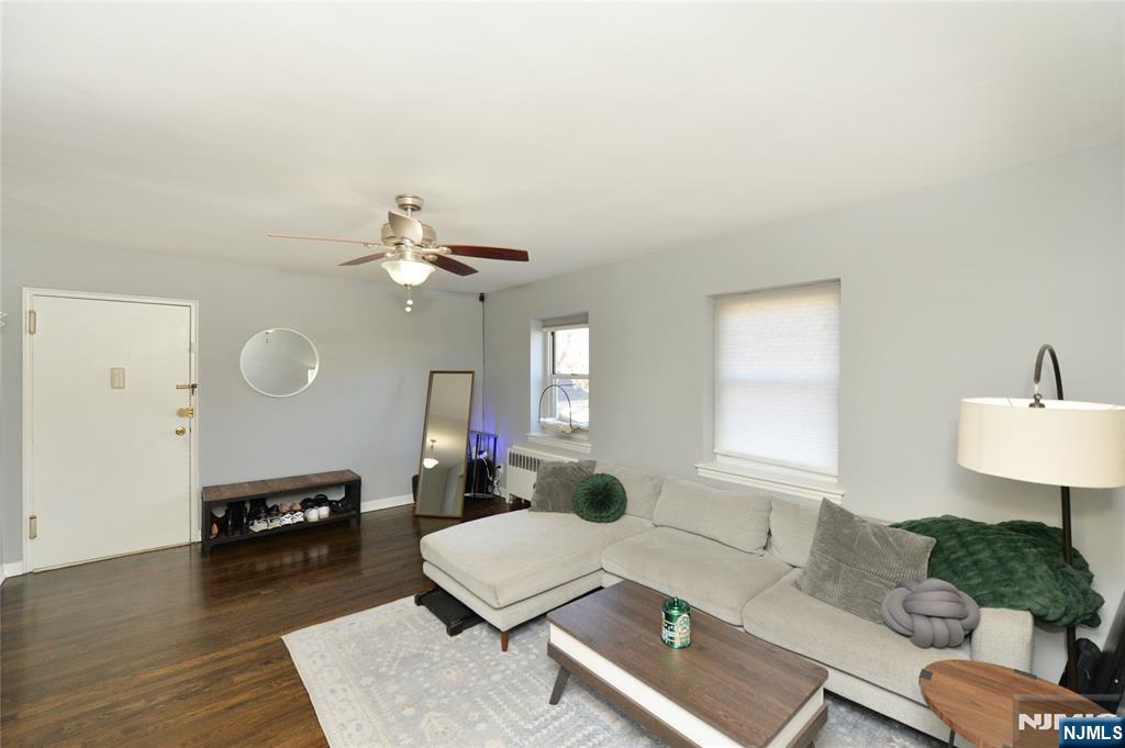 Bright and inviting first-floor corner condo in Hackensack! Enjoy warm hardwood floors throughout, a modern eat-in kitchen featuring granite countertops, stainless steel appliances, a smart fridge (2024), and a newer dishwasher (2025), along with an adjacent dining area. The spacious living room flows effortlessly to a full bathroom and a large bedroom with a double closet and abundant storage. This well-maintained building offers a designated parking space, on-site laundry, basement storage, and an on-site superintendent, providing everyday convenience and peace of mind. Ideally located just minutes from the New Bridge train station, approximately a 3-minute drive, with direct access to NYC and Hoboken, making commuting a breeze. Perfectly situated for comfort, convenience, and easy living! Maintenance includes SNOW REMOVAL, LANDSCAPING, COMMON AREAS, HOT AND COLD WATER