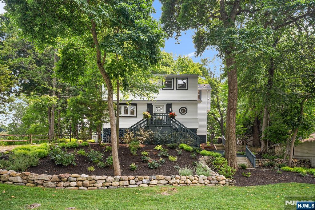 Beautifully renovated Farmhouse Colonial featuring a newer kitchen and baths, refinished oak floors, shiplap ceilings, LED recessed lighting, and more. The gourmet kitchen with premium Forno & ZLINE appliances opens to the deck, dining room, and a sunny breakfast nook. The first floor offers two private offices, one of which can serve as a guest bedroom. Upstairs are four bedrooms, an updated bath with double vanity, and convenient second-floor laundry. A whole-house generator provides peace of mind, while two long driveways offer ample parking. Prime location near Ramsey's vibrant downtown and top-rated schools. Showings begin July 16.