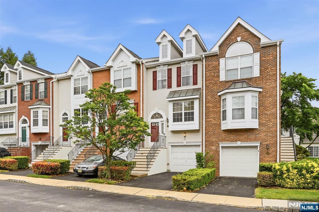 Nestled within the prestigious gated community of Cambridge Heights, this beautifully updated tri-level townhome offers the perfect blend of space, style, and convenience. Featuring 2 bedrooms and 2.5 baths, this residence is thoughtfully designed for modern living. Step inside to discover warm wood flooring flowing throughout the home, creating an inviting atmosphere. The sun-filled, updated, eat-in kitchen showcases gorgeous Quartz countertops, a custom backsplash, modern appliances, and generous counter space, ideal for morning coffee or entertaining guests. The adjoining living and dining areas provide a seamless layout, while a powder room and coat closet complete the main level. Upstairs, the private living quarters include two spacious bedrooms and two full bathrooms. The primary suite features an en-suite bath and ample closet space, while the second sunlit bedroom offers two closets and easy access to the second full bath. A conveniently located laundry area is also situated on this level. The lower level boasts a versatile walkout family room perfect for a media room, office, gym or all 3. The door leads to a peaceful patio retreat and the attached one-car garage adds convenience. This home also features a brand new TRANE HVAC system, water softener, Reverse Osmosis system & updated baths. Residents enjoy a pool, fitness center, tennis courts, playground, clubhouse, easy commuting options, restaurants, shopping, and more nearby.