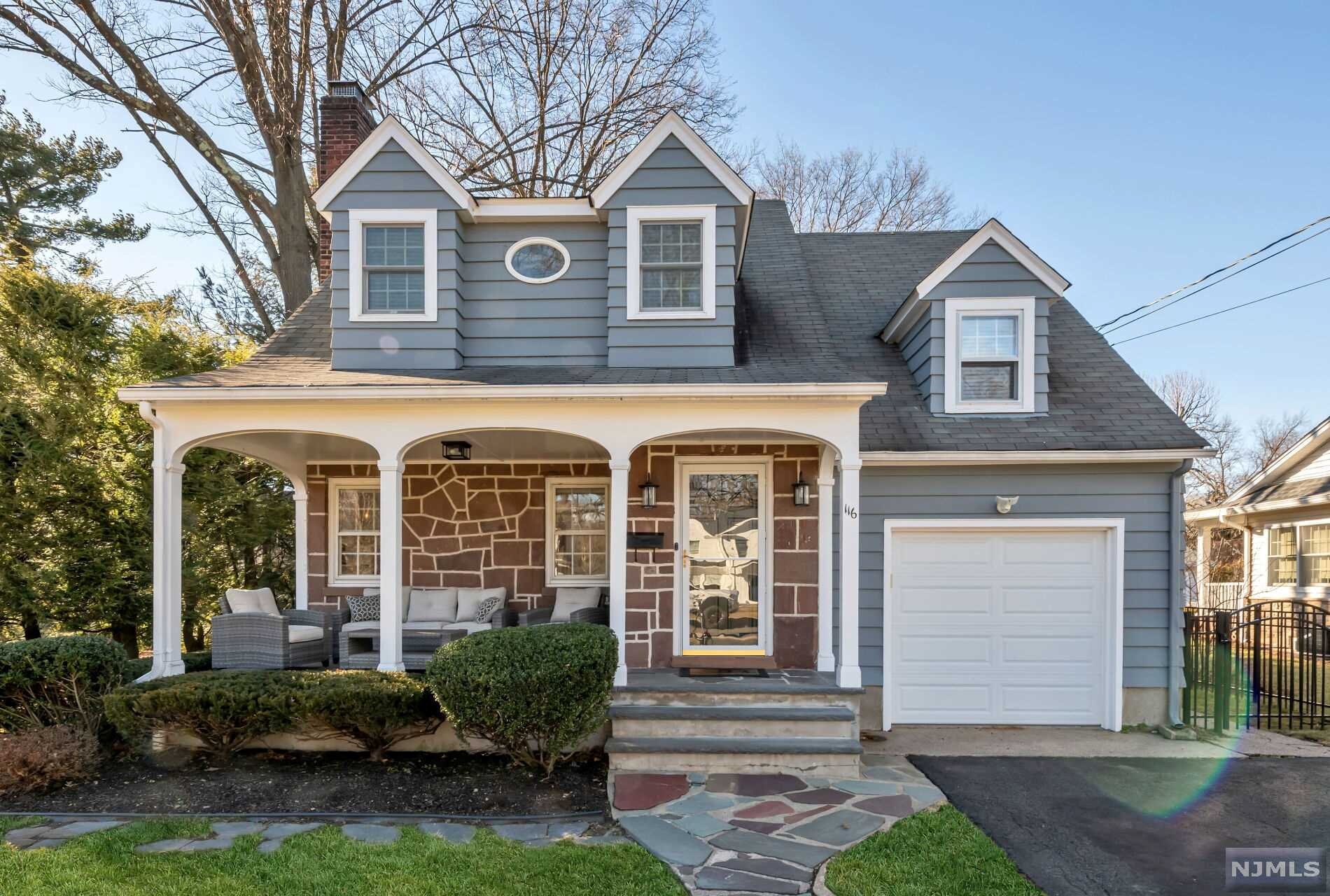 Location, location! This immaculate 4+ Bedroom colonial in Ridgewood's Somerville district is a true gem. The charming sandstone exterior and porch opens into an open & airy living space with hardwood floors & high ceilings. A large living room with gas fireplace & built-in shelves leads to a pretty dining room, white kitchen with island & open plan family room with vaulted ceiling & skylights. Enjoy the view from this room to a level fenced yard with bluestone patio & room to play. A mudroom, laundry & updated powder room round out this level along with a first -floor office. Upstairs there are 2 more baths & 4 generous bedrooms including a master suite. Newly refinished lower level adds even more living/recreational space. Central air. Tons of updates. Attached garage. Just steps to all three schools, NYC bus, parks & more. This won't last.