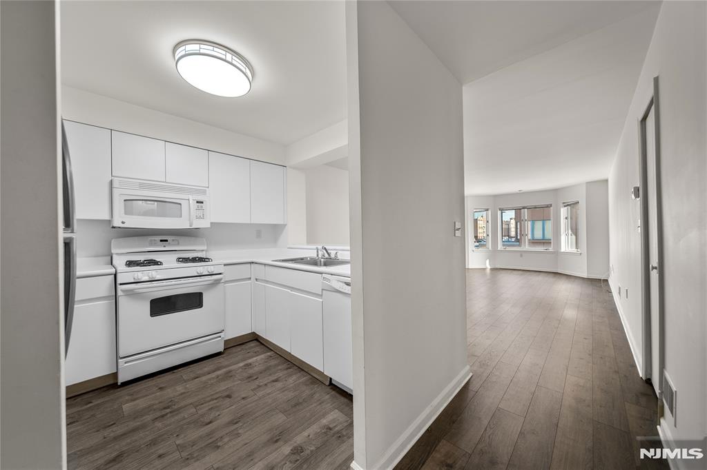 CALL/TEXT WAYNE @ 607-239-0541 FOR MORE INFO - INDEPENDENCE HARBOR - 402 CHASE COURT. Welcome to this beautifully maintained 1-bedroom residence in the desirable Independence Harbor community of Edgewater, NJ. This bright and inviting home features updated flooring throughout and has been freshly painted, offering a clean, modern feel. Enjoy scenic views of the New York City skyline that fill the space with natural light. Independence Harbor is a sought-after waterfront complex known for its convenient location, resort-style amenities, and easy access to shopping, dining, and transportation to NYC. A perfect opportunity for comfortable living in one of Edgewaterâ€™s premier communities.
