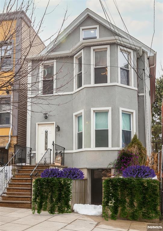 This exceptional two-family home in the vibrant community of Union City offers a generous backyard and limitless potential. Bathed in natural light from expansive windows and complemented by bright, modern finishes, each beautifully renovated unit features two spacious bedrooms and two full bathroom. The second-floor apartment also includes a loft on the third level, providing additional versatile living space. Meticulously redesigned with architectural flair and contemporary upgrades, this property seamlessly blends style, comfort, and functionality creating an elevated living experience for both owners and tenants. The expansive backyard serves as a private retreat, perfect for gardening, outdoor dining, entertaining, play, or simply relaxing in your own outdoor oasis. Ideally located just moments from premier transportation to New York City, this home provides outstanding accessibility while remaining nestled in a neighborhood known for its strong sense of community and rich history. With convenient access to public transportation and major highways, commuting to NYC or working remotely is effortless. Surrounded by local restaurants and shopping, this property offers the perfect balance of comfort, convenience, and urban lifestyle.
