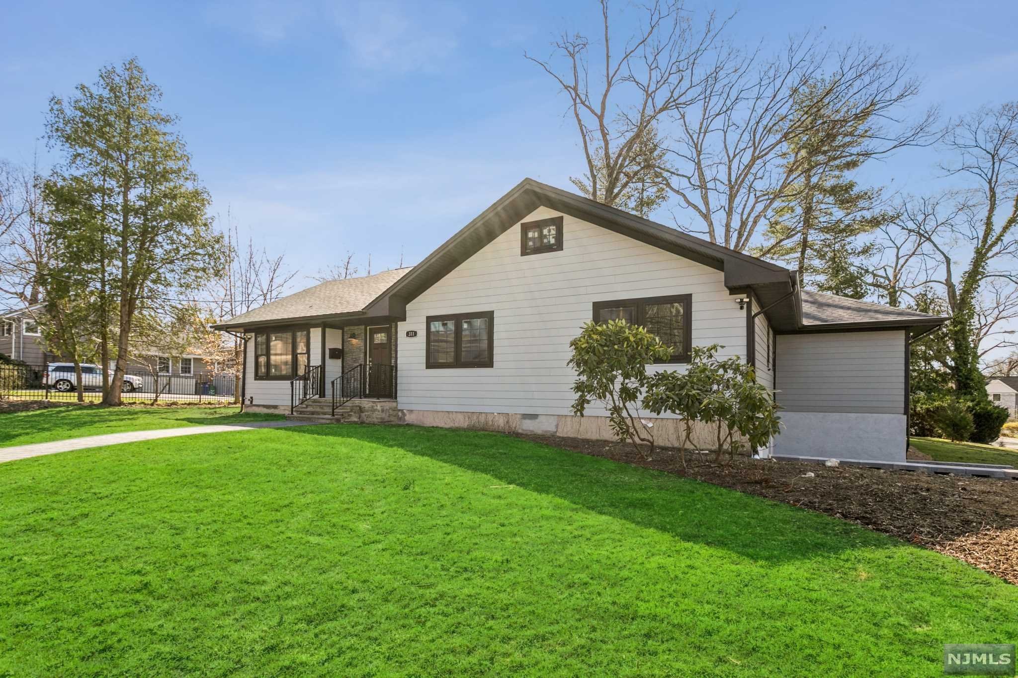 Newly renovated with the latest finishes & design, this 5BR/4BTH stunner is just 2 blocks from downtown & NYC transit. Cement-board siding, gleaming hardwoods, plank ceilings, beautiful tile work, sleek fixtures, new baths & kitchen with new cabinetry/Quartz counters, this house offers space & style. Enjoy a large FDR, LR w/ FPL, great room w/ vaulted ceiling & big deck, also accessible from the BR wing. The primary suite has 2 walk-in closets and FBTH. Also, on the main floor are 3 more BRs & 2FBTHs w/double sinks & beautiful tile work. The lower level has grade-level access to the garage & side entrance. There is also a mudroom, media room, bonus space, storage & a large BR w/en-suite FBTH. The property gives a chic city vibe in the heart of Hillsdale, The Goldilocks of Pascack Valley. It sits on a big corner lot w/double-wide driveway, accessible from side street. New HVAC, electrical, plumbing, roof, siding, Andersen Windows & appliances. '20-'21 taxes: $13,985. New taxes TBD