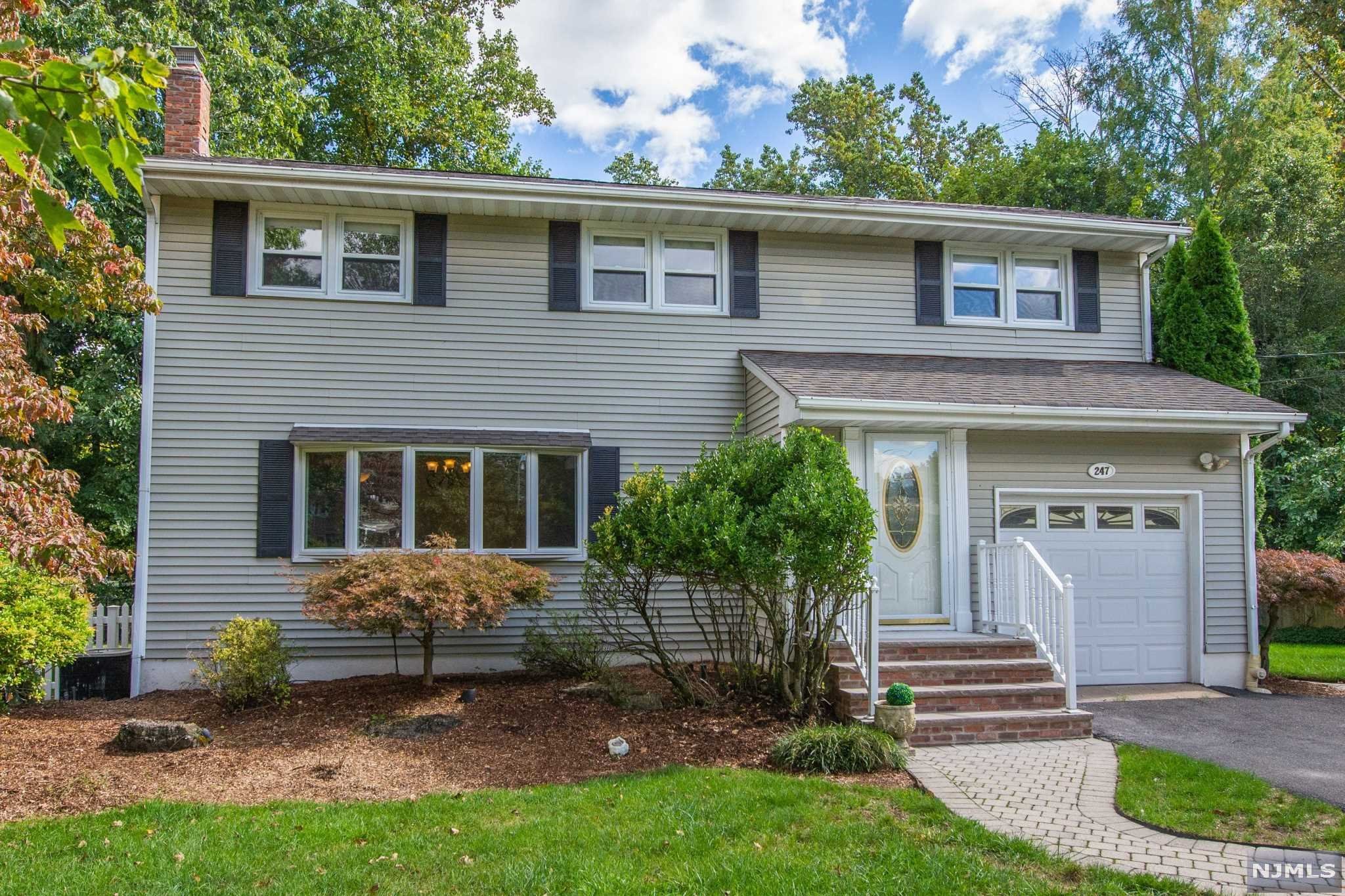 Welcome to this Colonial-style home in the sought-after town of Ramsey in Bergen County New Jersey, in one of the best neighborhoods. This home offers a spacious layout, hardwood floors, gas heat/central AC,newer kitchen appliances-Washer & Range are brand new, microwave and dishwasher were changed in 2019 and 2020,bathroom countertops were all installed in 2020, finished basement w/ projector/screen and surround sound, great sized deck off of the great room. Gas fireplaces in the living room and wood burning FPL w/ gas starter in the great room. Enjoy the private property and enormous-sized wooded property on the other side of the picturesque Valentine babbling brook. Enjoy all Ramsey has to offer, as this home is close to the town pool, great restaurants, shops,bus pick for schools and easy commute to NYC with 2 train stations. Make your appointment today.