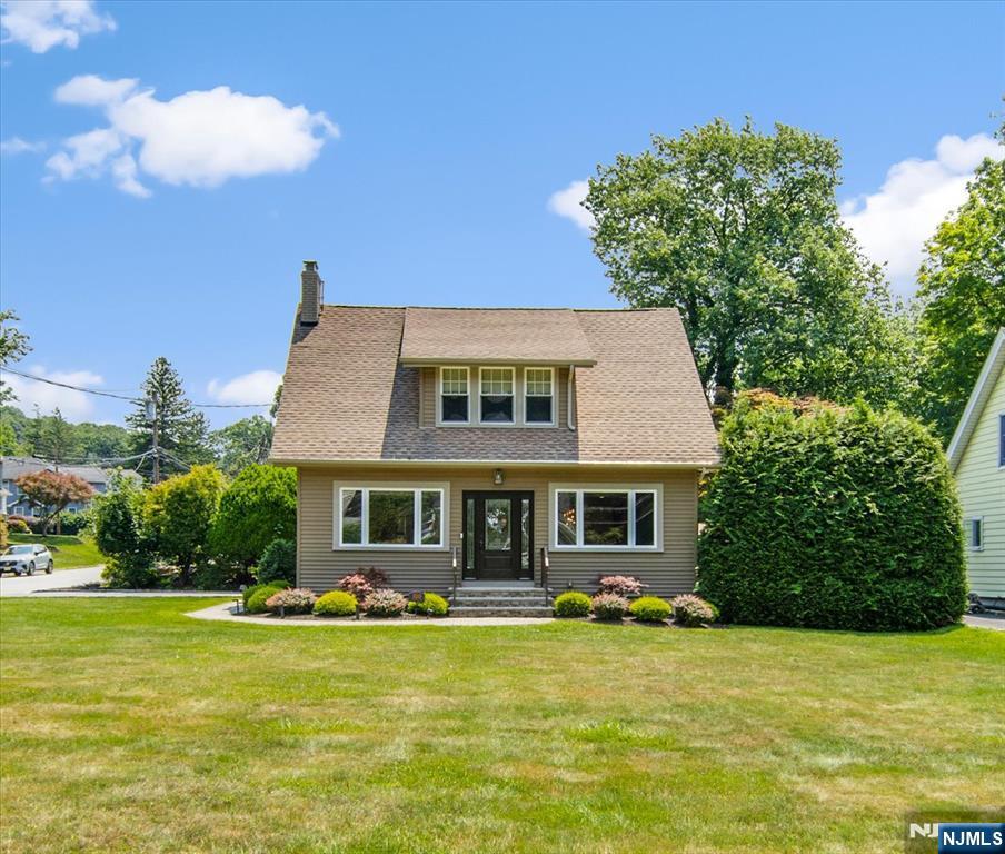 Welcome to this beautiful and renovated 4-bedroom, 2-bath home in one of North Jersey's most desirable communities. This move-in-ready home offers a bright, open layout with hardwood floors, abundant natural light, and a cozy fireplace. The luxury chef kitchen features a center island, stainless steel appliances, and plenty of cabinet space. Sliding glass doors lead to a spacious deck and a private, low-maintenance backyard, perfect for relaxing or entertaining. The first floor includes a flexible bedroom that can also be used as a home office, a full bath, and a convenient laundry room. Upstairs, you'll find the primary bedroom, two additional bedrooms, and a second full bath. Located in a top-rated school district with low property taxes, this home is close to parks, shopping, restaurants, major highways, and public transportation for an easy commute to NYC. Don't miss this opportunity to own a beautifully updated home in a quiet, commuter-friendly neighborhood.