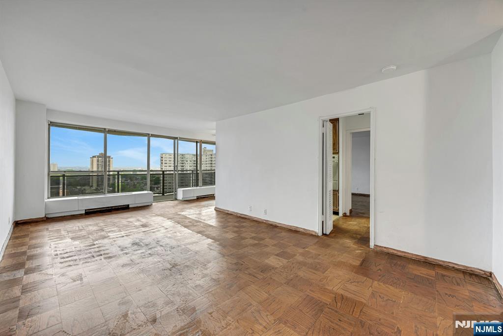 Rare opportunity to renovate and customize this high-floor 20th-floor 1-bedroom, 1-bath apartment in the desirable Pembroke co-op. Offering excellent natural light with east-facing and south-front exposures, this unit features stunning views of the New York City skyline, Hudson River, and George Washington Bridge along with beautiful sunset views. Great potential for a buyer looking to create their ideal space. Full-service building featuring a 24-hour doorman, outdoor pool, exercise room, laundry, elevator, and on-site security. Maintenance approximately $1,313/month includes taxes, gas, heat, water, common area maintenance, and building amenities. Parking available for a fee subject to availability. Conveniently located within walking distance to NYC transportation and the George Washington Bridge, as well as close to major highways, shopping, restaurants, parks, and schools. Subject to board approval. Minimum 20% down payment and 4:1 income-to-debt ratio required by the co-op board. Apartment being sold strictly as-is. Some photos have been virtually staged 4/6/10/14.