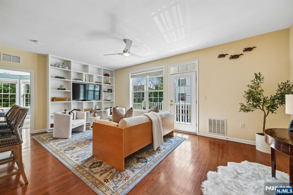 Beautiful Begonia model filled with sunshine and bright, open living spaces! The refreshed kitchen features a new electric stove and cooktop, elegant backsplash, updated hardware, bright new countertops, and cabinetry finished all the way to the ceiling no open gaps for a clean, custom look. The spacious primary suite offers an enormous closet and serene views of the park and trees in bloom. Enjoy your morning coffee on the private terrace overlooking adjacent walking paths and lush greenery. Additional highlights include a private in-unit laundry room, attached first-floor private garage access, and a large storage space. The Four Seasons lifestyle amenities are truly unmatched: craft/card room, billiards room, ballroom, fitness center, indoor pool, terrace room, outdoor pool, bocce courts, tennis courts, and pickleball all set against stunning views of the NYC skyline.