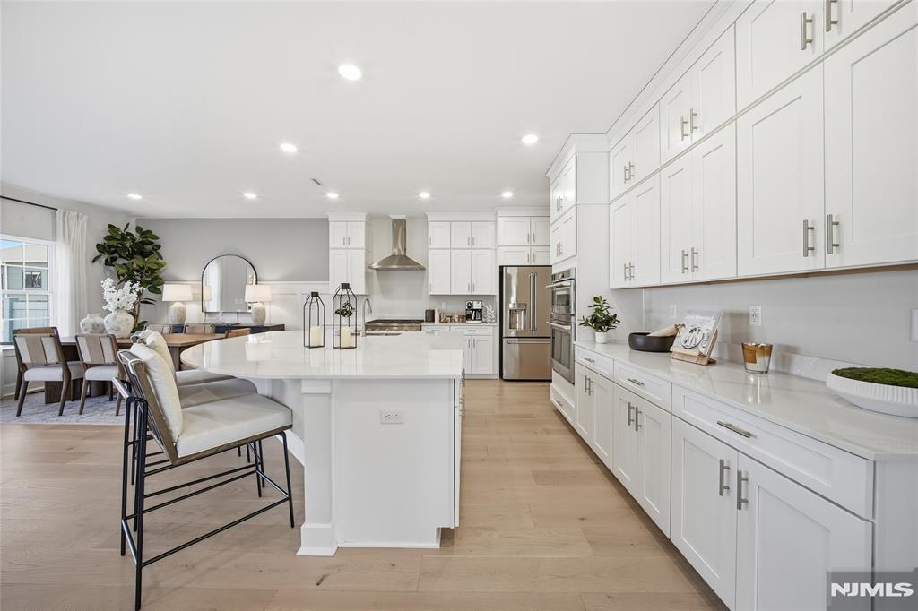 NEW CONSTRUCTION IN OAKLAND, NJ! JULY MOVE-IN! Welcome to The Ridings at Oakland, where contemporary luxury meets low-maintenance living in one of Bergen Countyâ€™s most desirable locations. This stunning new construction townhome, ready for move-in this July, offers thoughtfully designed living space with upscale finishes throughout. The open-concept main level features a spacious Great Room with a cozy corner fireplace that flows seamlessly into a chef-inspired gourmet kitchen and sunlit breakfast area, perfect for entertaining and everyday living. Sliding glass doors lead to a private deck, creating the ideal outdoor retreat. Upstairs, a versatile loft provides flexible space for a home office, media room, or lounge, while the luxurious primary suite features a spa-like bath and dual walk-in closets. Two additional generously sized bedrooms and a convenient second-floor laundry area complete the upper level. The finished basement with a full bath offers exceptional bonus space ideal for guests, recreation, or a home gym. Enjoy the ease of brand-new construction and a prime Oakland location close to shopping, dining, parks, and major commuter routes. Schedule your private tour today!