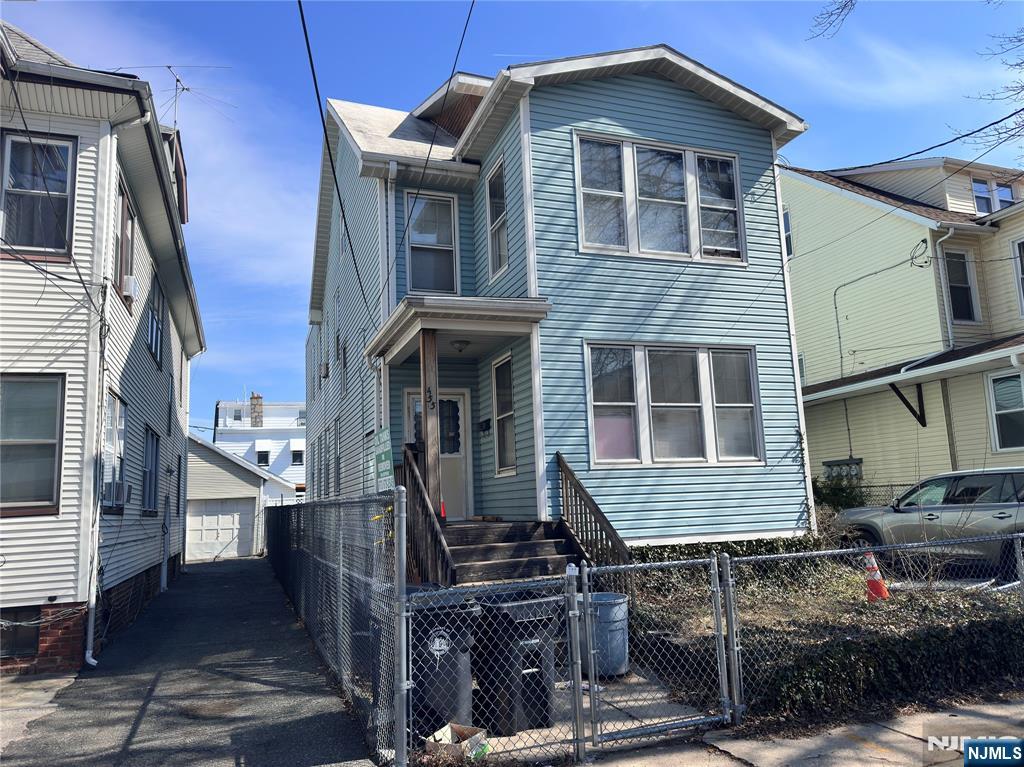 INVESTOR SPECIAL! 455 N 12th St is a large 3 unit property with parking, in a very desirable Newark neighborhood on the Bloomfield border, with tons of potential to become a rental income cash cow! Unit1 incudes living rm, eat in kitchen, front porch, 2 bedrooms, and full bath. The front porch area can potentially be converted to a 3rd br. Unit 2 has a large living room, 3 bedrooms, eat in kitchen, full bath, and front porch area that can potentially be 4th bedrooms. Unit 3 has a living area / br, eat in kitchen, and full bath. The basement is spacious and partially finished, also including a half bath. On the exterior the property has a long driveway with parking for up to 3-4 cars and a large detached garage for additional storage. The property is located in a very desirable neighborhood near schools, shopping, and public transportation. Please note this property needs full renovations and is suitable for cash buyers only.