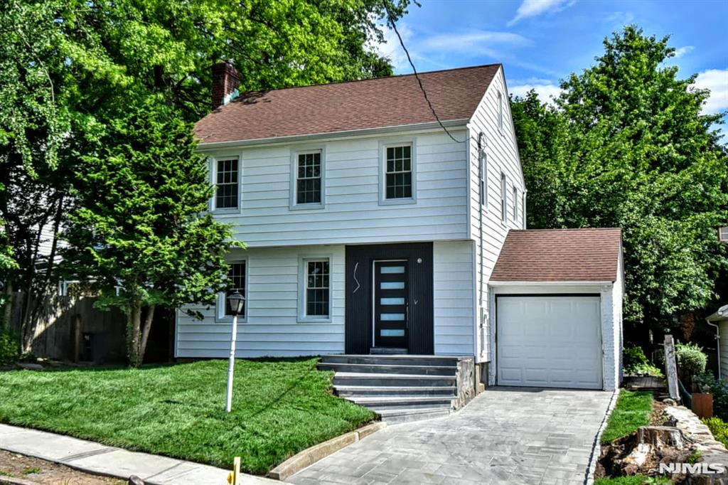 Welcome to this beautifully renovated 3-bedroom, 1.5-bath home where modern design and everyday comfort join together seamlessly. Thoughtfully updated from top to bottom, this stunning residence features an open-concept floor plan ideal for both entertaining and daily living. The heart of the home is the brand-new designer kitchen, showcasing contemporary finishes and flowing effortlessly into the living and dining areas. Both baths have been completely renovated with stylish, modern appointments. Step outside to enjoy the brand-new deck, perfect for outdoor dining, relaxing, or hosting gatherings. Curb appeal abounds with a beautiful paver driveway and elegant new curved front stairs that create a welcoming first impression. Ideally located in the desirable town of River Edge, this home offers convenient transportation options for an easy commute to New York City, along with a vibrant selection of local restaurants, shops, and everyday conveniences nearby. Move right in and enjoy the perfect blend of modern upgrades, timeless style, and an unbeatable location.