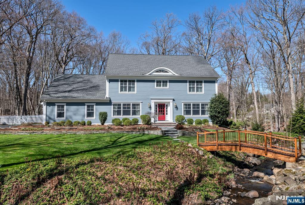 One-of-a-kind center hall colonial set on nearly 1.3 acres of breathtaking park-like property in one of Allendaleâ€™s most desirable neighborhoods. A beautiful entryway welcomes you to a seamless layout, including a sunlit living room, formal dining room and a gourmet eat-in kitchen with French doors to an expansive covered terrace. The inviting family room features a wood-burning fireplace and the nearby den or playroom leads you to a convenient mudroom and attached garage. Upstairs youâ€™ll find 4 bedrooms including a luxurious primary suite with a sitting area, gas fireplace, ensuite bath and private office. The finished lower level boasts a newly-built custom 1,300-bottle wine room, TV room and game room. The thoughtfully designed backyard is perfect for entertaining with an in-ground pool, hot tub, and tranquil views of the babbling brook from every angle. Ideal location to top-rated schools, shops, transportation & more.