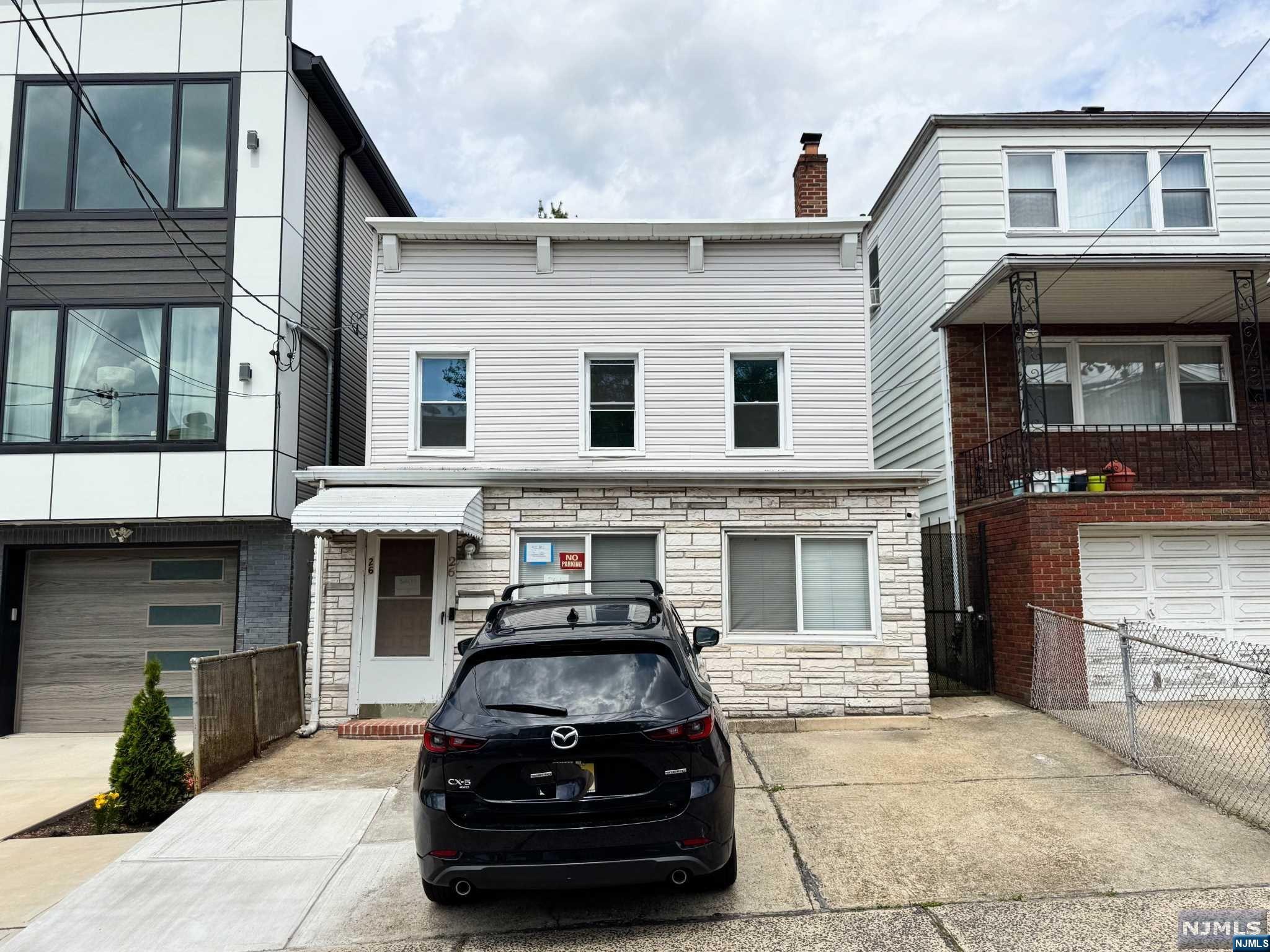 The possibilities are endless in this Jersey City Heights single family home. This golden opportunity has a 25x100 ft lot size and is strategically located only a few blocks from Journal Sqaure and the Path Station making it a true commuter's dream. The first floor features the living room, kitchen, utility room, bathroom, and 2nd floor has two bedrooms and a full primary bath. There is parking for 2 cars in the convenient driveway and only minutes away from a great selection of JC's restaurants, parks, schools, shops, and more! Your next project awaits, come see it