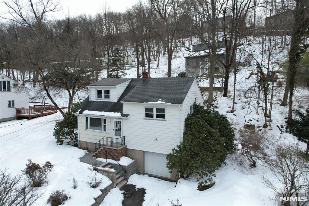 This thoughtfully updated home is located in the desirable hillside section of Wayne, offering comfort, style, and convenience in one exceptional setting. Inside, you'll find a newly redesigned open-concept floor plan that creates a bright and seamless flow between living spaces ideal for both everyday living and entertaining. The fully updated kitchen is a true standout feature, showcasing brand-new stainless steel appliances, quartz countertops, a center island, and a modern layout designed for both style and functionality. The home offers three generously sized bedrooms, a spacious living room, and a dining area with direct access to the backyard, providing easy indoor-outdoor living. The bathroom has been newly remodeled with contemporary finishes. All hardwood oak floors have been beautifully refinished, the entire home has been freshly painted, and new doors have been installed throughout, creating a clean, move-in-ready feel. Conveniently located near restaurants, shopping, and major highways, this property combines modern updates, and a prime location. Making this a true turnkey opportunity in one of Wayne's most desirable hillside settings. A true turnkey opportunity in one of Wayne's most desirable hillside settings.