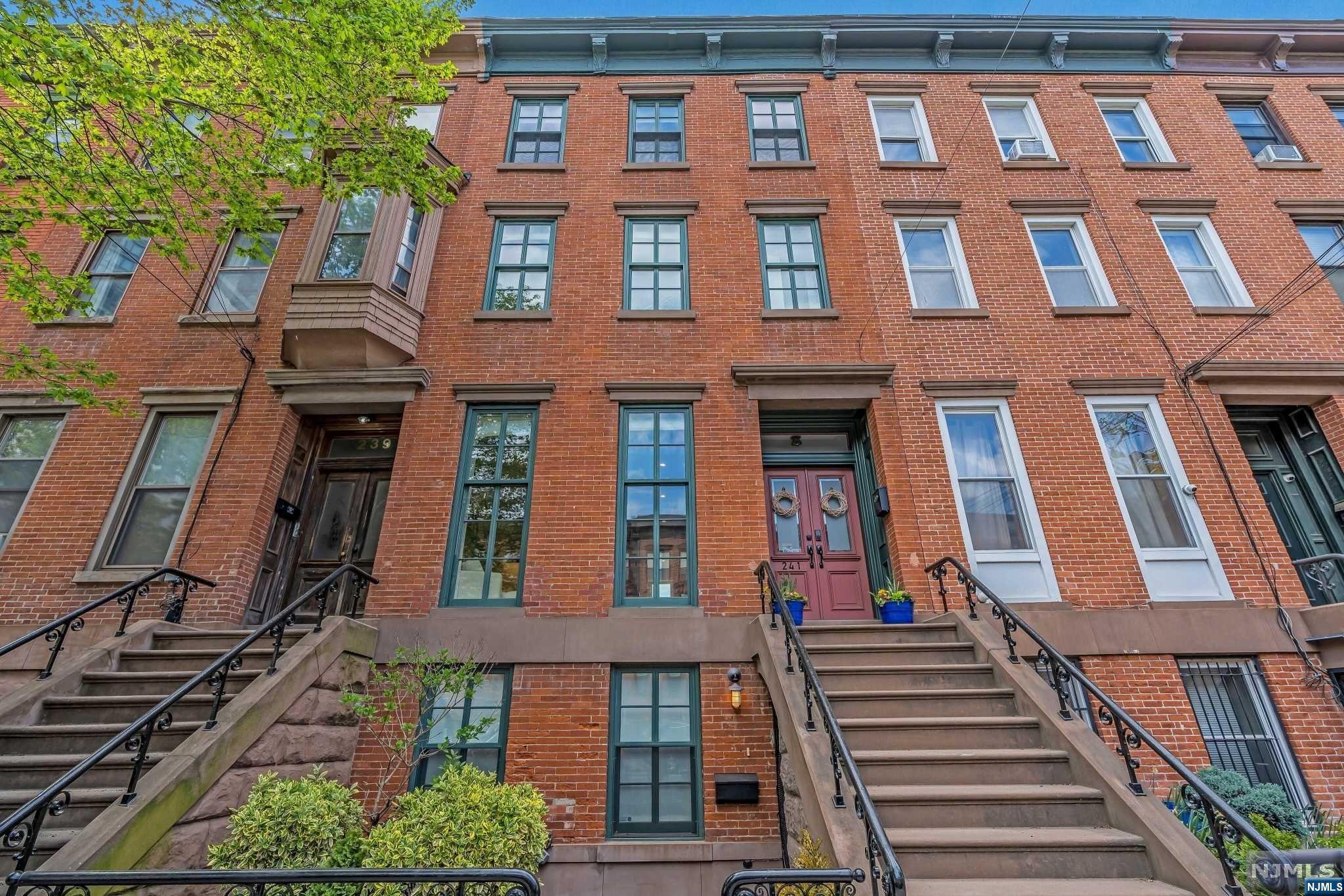 This luxurious home offers sophisticated living in the heart of Downtown JC. This beautifully renovated brownstone features 4 full floors of living with modern amenities & high-end finishes, making it the perfect place to call home. The layout seamlessly flows from the living room to the dining area and kitchen which opens to a gorgeous deck & private backyard oasis, a true extension of living. The second floor features a master bedroom with a large walk-in closet as well as four other spacious bedrooms - each with its own bath & ample closet space. The garden level offers versatility, with the option of using it as a great room, media room, gym, in-law suite or renting it out for additional income. Currently used as a one family home, this is a legal two family. Don't miss your opportunity to own this stunning brownstone in one of the most desirable neighborhoods in Jersey City - schedule your private showing today!