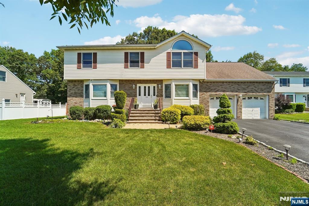 Beautifully maintained 4 Bedroom 2.5 Bathroom Center Colonial on a 0.37 acre lot in desirable Parsippany! This 2,541 sqft home offers an inviting layout with two spacious living areas, one featuring a cozy fireplace, plus a formal dining room ideal for entertaining. Updated eat in kitchen boasts cherry cabinetry, granite counters, tile backsplash & stainless steel appliances. Gleaming hardwood floors, crown molding & abundant natural light throughout the main level. Upstairs, the primary suite impresses with vaulted ceilings & an oversized arched window, plus a massive adjoining room offering flexible space for a home office, sitting room, or expansive walk-in closet. Three additional generously sized bedrooms complete the upper level. Finished basement adds valuable bonus living space. Enjoy outdoor living on the backside deck overlooking the expansive backyard. Attached 2 car garage with driveway parking fitting 4 or more cars! Zoned for Rockaway Meadow Elementary, Central Middle School & Parsippany High School. Prime location close to major highways & shopping. Don't miss this move in ready gem!