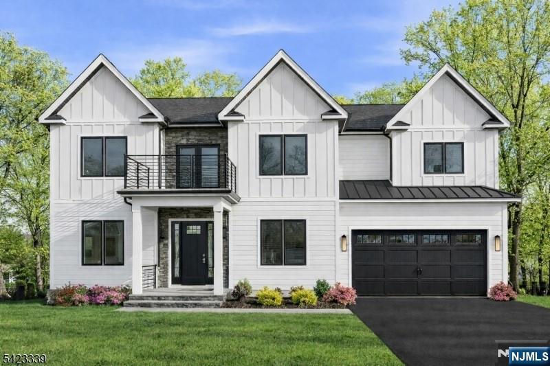 Set on a quiet cul-de sac this stunning NEW CONSTRUCTION CENTER HALL COLONIAL offers the perfect blend of luxury, space, and seamless INDOOR-OUTDOOR LIVING. Featuring 6 bedrooms and 5.5 baths on just under a third of an acre, this home offers approximately 4,800 sq ft of thoughtfully designed living space across 3 levels. A welcoming front porch leads into a bright, open layout with 10' ceilings, designer finishes, custom trim work, and hardwood flooring throughout. The gourmet kitchen is equipped with high-end Sub-Zero and Wolf appliances, a walk-in pantry, and flows effortlessly into the family room anchored with a fireplace opening to an expansive 600 sq ft deck overlooking a private backyard. The main level also includes a first-floor en-suite bedroom, private office, bar area, and a functional mudroom. Upstairs, the luxurious primary suite features its own 600 sq ft private balcony your own retreat along with a spa-like bath. 3 other bedrooms including another ensuite each with their own walk in closets. The WALK-OUT lower level is built for entertaining with a large recreation room, media room, wet bar, and access to a paver patio creating multiple outdoor living spaces ideal for year-round enjoyment. Additional highlights include smart home features, EV charger outlet, and a 10-year new construction warranty. Conveniently located near highways, shopping, dining, and houses of worship. This home is what you have been waiting for!