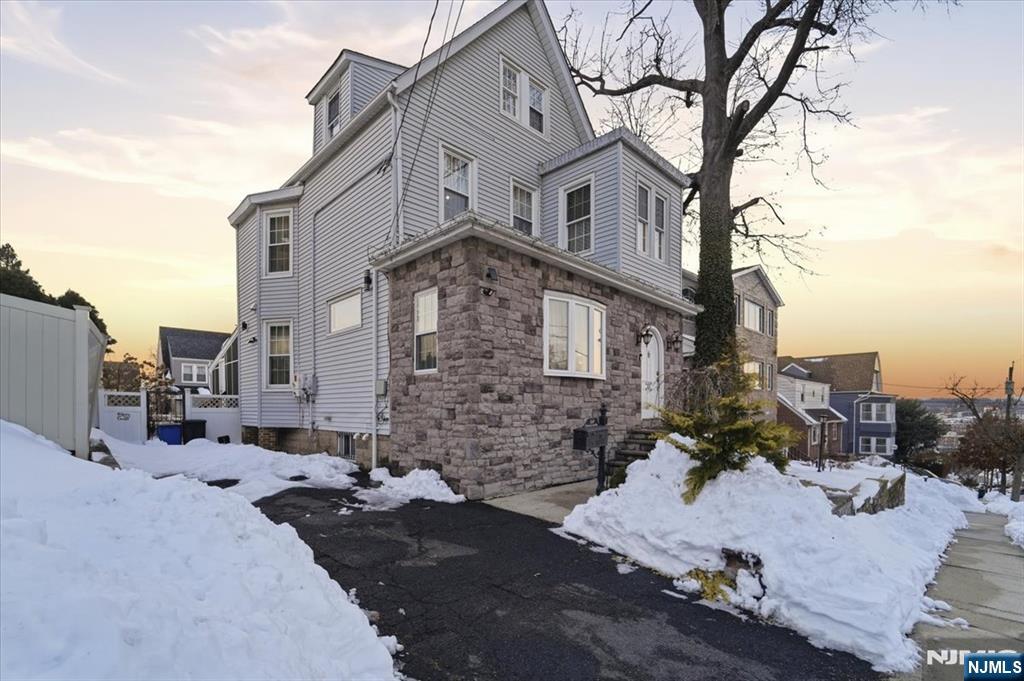 Beautifully renovated 1 Family home showcasing exceptional craftsmanship and timeless design. This residence features brand-new plumbing and electrical systems, along with a stunning modern kitchen and stylishly updated bathrooms. Thoughtful finishes and custom details throughout add warmth, character, and elegance to every space. Enjoy year-round relaxation in the enclosed sun porch overlooking the yard, perfect for morning coffee or evening gatherings. The expansive driveway offers parking for multiple vehicles. A rare and valuable convenience. Ideally located in a highly desirable neighborhood, this home offers the perfect setting for comfortable everyday living and effortless entertaining.