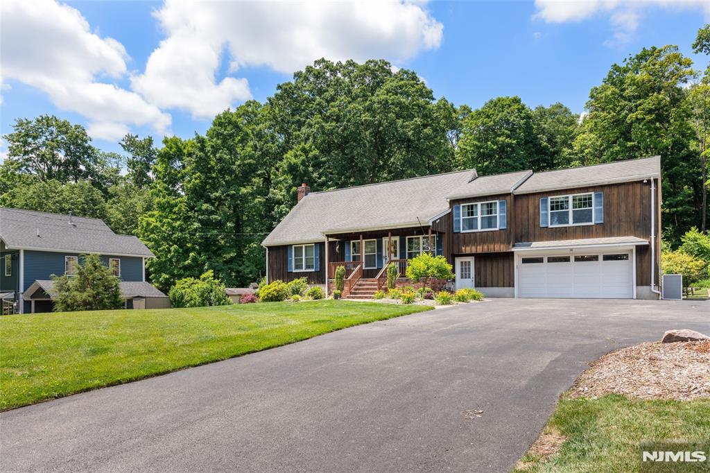 Welcome to 36 Hancock Dr. Custom built in move in ready condition with rustic charm and up to date amenities. Enter from the welcoming open porch into the great room accentuated by wood beams that add character and warmth. Chef's kitchen with wood cabinetry and center island, stainless appliances and farm sink open to dining area. Family room offers wrap around windows with view of the pool, deck and private property. this level offers bedroom, office, full bath. Upper level has a loft/library, bedrooms 2 full baths. there are five bedrooms in total, but please note that the home is currently on a three -bedroom septic. Finished basement offers recreational room, a dry bar, gym, ldry, storage, 1/2 bath and access to well manicured back yard. Oversized 2 car garage and parking for many vehicles. Must stop by to view this custom home.