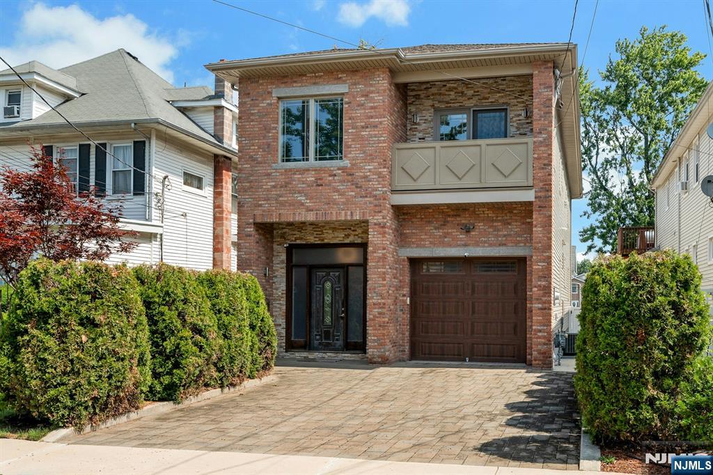 Welcome to this beautifully crafted custom home offering the perfect blend of luxury and comfort. Built in 2014, this exceptional residence features approximately 2,412 square feet of living space with 3 spacious bedrooms and 3 full bathrooms. Step inside to a light and inviting open-concept floor plan highlighted by a gas fireplace, hardwood flooring, gorgeous crown moldings, and elegant finishes throughout. The gourmet kitchen showcases quartz countertops, a kitchen island, premium cabinetry, and abundant workspaceâ€”flowing seamlessly into the expansive living room, ideal for entertaining. The second level features a luxurious primary suite with an en-suite bath, a huge custom walk-in closet, balcony, and a versatile flex space which can be used as a nursery or office area. Two more bedrooms open onto stone balconies. An additional full bathroom and a dedicated laundry room complete the space. Outside, enjoy a private, fully fenced backyard with a welcoming patioâ€”perfect for outdoor dining, or relaxing evenings. Additional amenities include, two-zone central air conditioning, central vacuum, Anderson windows, an underground sprinkler system, and an attached one car garage with a paver driveway. Ideally located near schools, restaurants, parks, and the Lyndhurst train station. Own a newer construction home in one of Lyndhurstâ€™s most desirable neighborhoodsâ€”where quality craftsmanship, timeless style, and an unbeatable location come together.