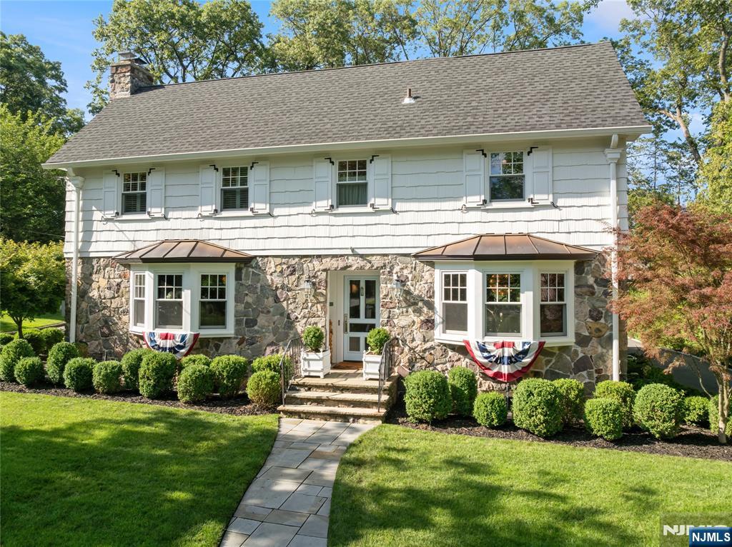 Exceptional Center Hall Colonial in one of Ridgewoodâ€™s Coveted neighborhoods. This impeccably maintained Center Hall Colonial is ideally situated just two blocks from Willard Elementary School, blending timeless elegance with thoughtful updates. Featuring 4 bedrooms and 3.5 baths, this home offers a rare combination of charm, craftsmanship, and design. At the heart of the home is a show-stopping kitchen designed for entertaining, boasting 9'5" ceilings, Grasshopper Green Waterworks cabinetry with icebox hinges, a custom bar with beverage refrigerator and polished nickel shelving, and a stunning 9' x 6' Calacatta marble island. Floor-to-ceiling custom windows and doors flood the space with natural light and provide seamless access to the outdoors. Spacious formal living room with marble fireplace surround, a family room with vaulted ceilings, and a formal dining room with custom built-in bookcases, grasscloth wallpaper, and a vintage Emil Stejnar starburst chandelier. A renovated basement offers a full bath and laundry room. Other features include a custom-built mudroom and generous powder room.Upstairs, the primary suite features a full bath and walk-in closet, while three additional bedrooms and an updated hall bath provide ample space for family or guests. Owner has NJ Real Estate License. Contact Jeff Feagles at 201-803-9624 for more information or to schedule a showing.