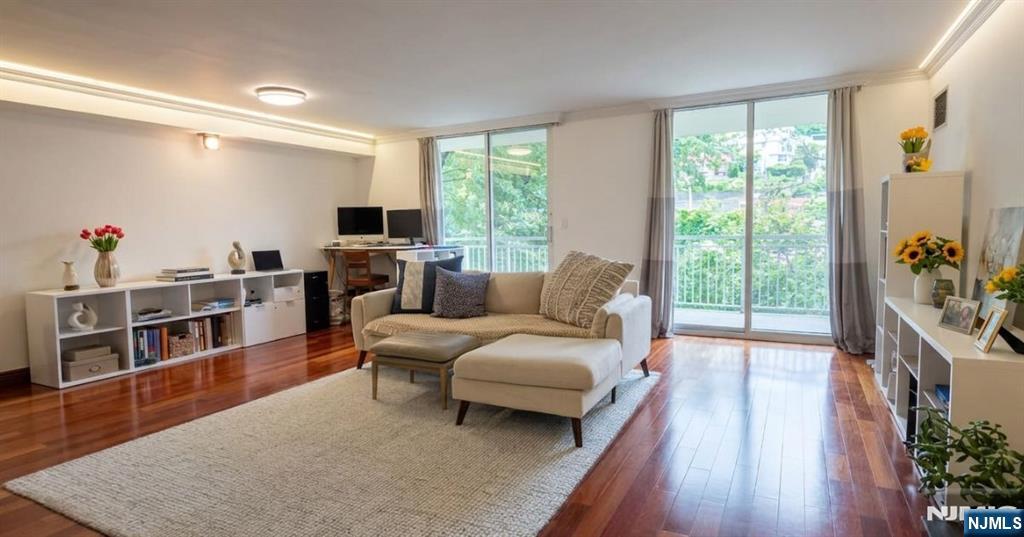 Welcome to 'Admiral's Walk' condo community. This massive 1 bedroom offers 1,074 SF as the living space along with a large private balcony and variety of amenities. Community is steps from NY Waterway Ferry, Bus to NYC, Wholefoods, restaurants and just a few minutes drive to shops, entertainment and so much more. ** This beautifully maintained one bedroom condo home presents a bright and airy interior with an open layout and updated 1.5 bathrooms for both everyday living and entertaining. ** Spacious ensuite bedroom provides a peaceful retreat, while the ensuite bathroom offers custom double showers for those busy mornings. In the living room, double sliding glass doors invite natural light to pour in, creating a warm atmosphere throughout. Spaces flow seamlessly here, offering versatility for your lifestyle. The kitchen is thoughtfully designed with ample cabinetry and workspace, ideal for both casual meals and hosting. ** Amenities include 24 hour concierge desk, community room for your private events, fitness room, tennis court, walk way along the river walk, pool, etc. A refined waterfront offering in the heart of Edgewater where modern comfort meets effortless convenience. ** Set along the Hudson River, this residence offers a lifestyle defined by accessibility and ease. Enjoy proximity to shopping, dining, parks, and direct transportation options to New York City, making commuting simple and efficient.