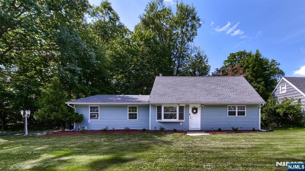 Opportunity knocks to own this beautifully renovated, move-in ready home nestled on a private cul-de-sac with park-like property. Renovated in 2016 with quality craftsmanship, this 4-bedroom, 1.1-bath home offers approximately 1,656 sq ft of living space designed for today's lifestyle. The heart of the home is the gourmet kitchen, featuring granite countertops, stainless steel appliances, abundant cabinetry, and an effortless flow into the spacious den/dining room, highlighted by a large picture window overlooking the backyard. A separate, sun-filled living room with a bay window provides additional space for entertaining. The main level features a primary bedroom, a second bedroom, and a full bath. Upstairs are two additional bedrooms, and an updated half bath. Approximately 10-year-old updates include windows, siding, central air, furnace, hot water heater, upgraded electrical, insulation, recessed lighting, crown molding, hardwood floors, and more. The roof is approximately 5 years old. An oversized attached garage provides exceptional storage. Ideally located near schools, shopping, restaurants, major highways, and NYC transportation. Simply unpack and enjoy!