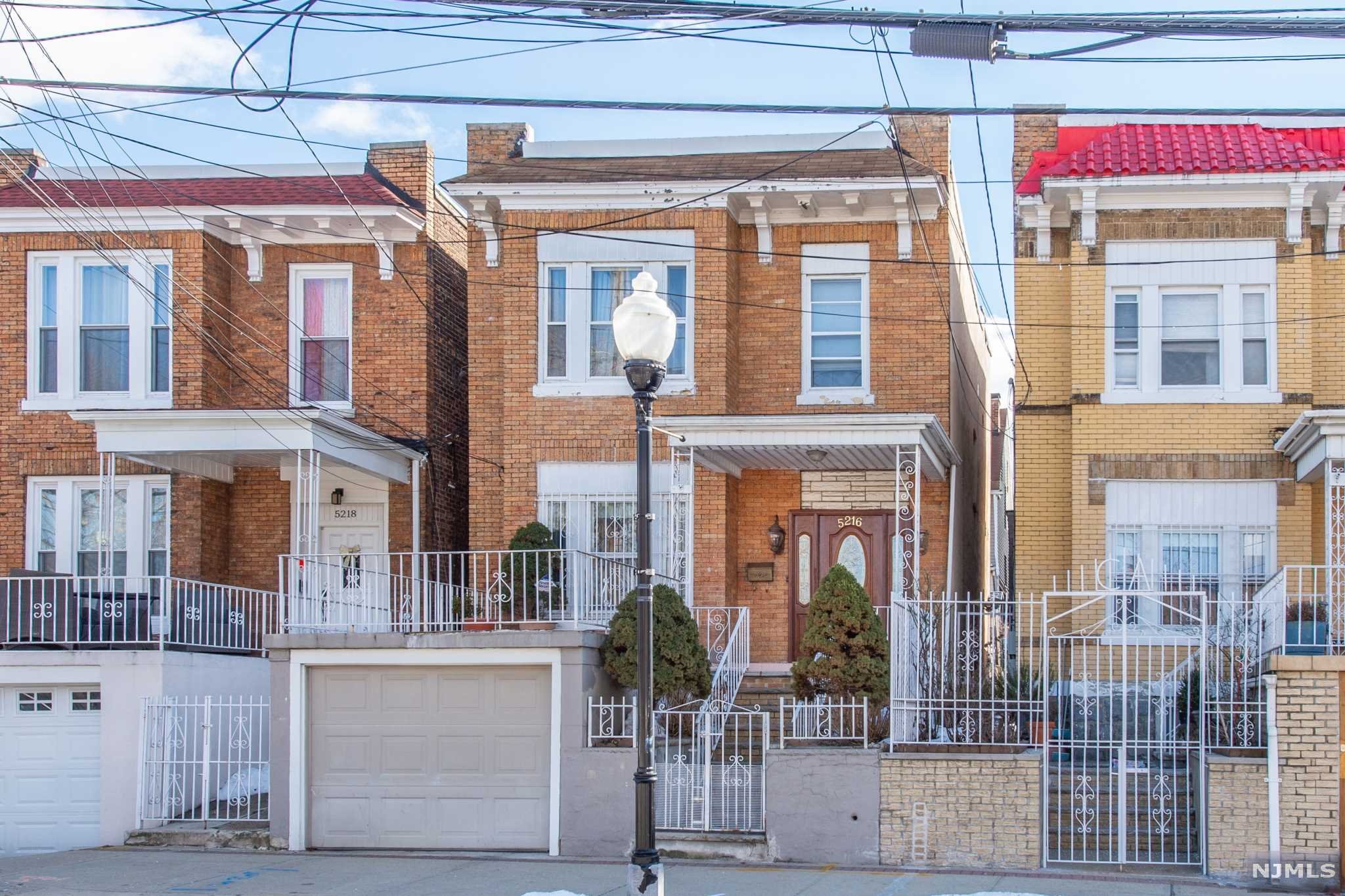 Amazing 2-family home located only a block to the prestigious Blvd East! . First floor features a spacious 1 bedroom unit with full bath, eat-in kitchen, living room, and spacious dining room that could be converted into second bedroom. Fully finished walk-out basement with family room, rec room, summer kitchen, and 1.5 bathrooms. 2nd unit features a lovely updated 2 bedroom, 1 bath unit with recently remodeled flooring and bathroom. Large terrace over 1 car garage! All separate utilities, recently upgraded. Gorgeous neighborhood with plenty of shops, parks, and local eateries. Only 15 mins to Manhattan. Perfect for the owner occupant or investor alike. Don't miss this!