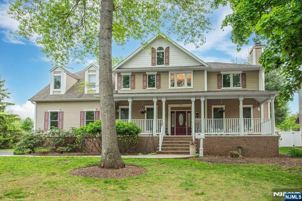 Welcome to this custom Colonial featuring a charming front porch and impressive 2 story entry foyer. The first floor offers beautiful hardwood floors, a formal living room with a gas fireplace, a large formal dining room, and a spacious, sun-filled family room with a wood-burning fireplace and sliders leading to the deck. This level also includes a first-floor bedroom, full bath, laundry room, and an expansive open-concept kitchen with a center island with seating, stainless steel appliances, and a bright breakfast room with ample space for everyday dining.The second level features 4/5 bedrooms, including an ensuite bedroom, a hall bath, and a generously sized primary suite complete with a large spa-like bath offering a walk-in shower, jetted tub, dual vanities and walk-in closet.The oversized walk-out basement has already been framed for multiple rooms, including a bathroom, and is ready to be finished to suit your needs. Conveniently located near restaurants, schools, transportation, and major highways, this home offers space, comfort, and endless potential.