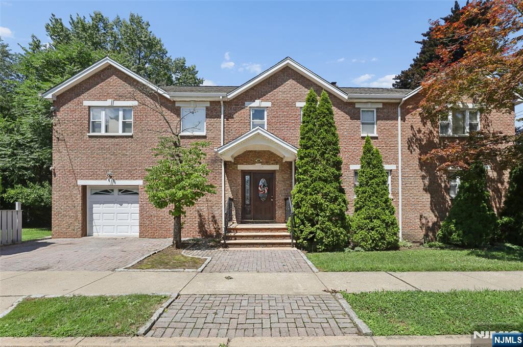 Welcome to this beautifully maintained and generously sized Colonial home offering 4 bedrooms, 3 full bathrooms, a finished basement, and a private, nicely sized backyardâ€”perfect for comfortable living and entertaining. The first floor features a welcoming entry foyer, a spacious eat-in kitchen with an abundance of cabinetry, dining room, a bright living room, a convenient laundry area, and a full bathroom. Upstairs, you'll find an impressive primary suite complete with a private en-suite bath and two walk-in closets. Three additional generously sized bedrooms, another full bathroom, and a large family room provide plenty of space for family, guests, or a home office. Additional highlights include a finished basement offering flexible living or recreation space, an attached one-car garage, and multi-zone heating and central air conditioning for year-round comfort. Ideally located within walking distance to the commuter bus and just minutes from the train station, this home offers an easy commute while being only 10 miles from New York City. Enjoy the perfect combination of spacious suburban living and exceptional convenience. Don't miss this wonderful opportunity to own a beautiful home in a highly desirable location!