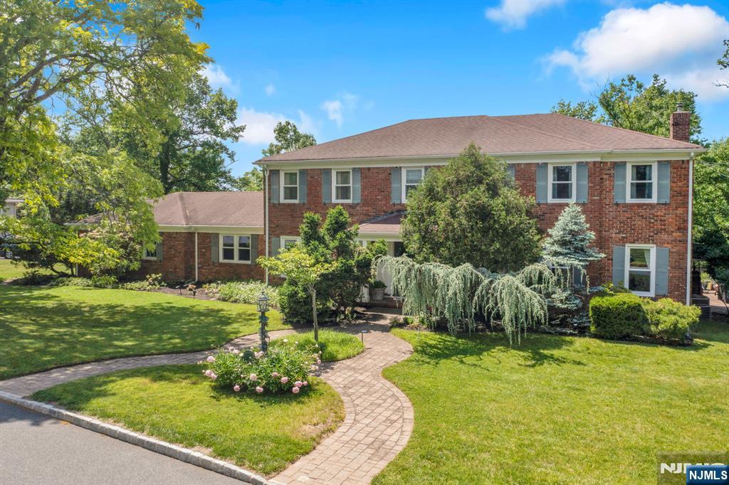 Nestled in one of West Orangeâ€™s most desirable neighborhoods, this elegant Center Hall Colonial offers exceptional space, comfort, and potential. The main level features a family room with a fireplace, formal living and dining rooms, a spacious eat-in kitchen, plus a first-floor bedroom and full bath ideal for guests, a home office, or flexible living. Upstairs, the oversized primary suite includes a walk-in closet and private en-suite bath, while additional generously sized bedrooms provide plenty of room for family and guests. The finished basement boasts a large recreation room with a custom bar, bonus flex space, and ample storage. Outside, enjoy a beautifully landscaped backyard with a patio, mature plantings, and plenty of room to relax or entertain. Complete with a two-car attached garage and oversized driveway, this home is ideally located near parks, shopping, dining, and major transportation. A rare opportunity to own a classic Center Hall Colonial in one of West Orangeâ€™s most sought-after locations.