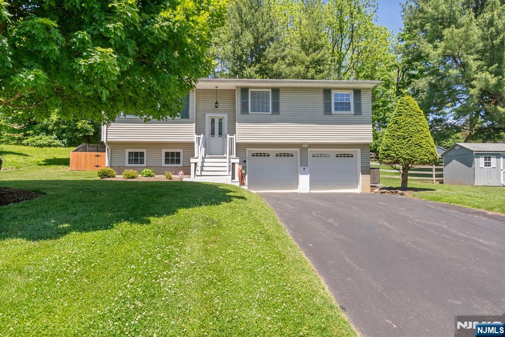 Welcome to 34 Beavers Street in the charming Borough of High Bridge! This beautifully maintained bi-level home offers 3 bedrooms, 1.5 baths, ana approximately over 1500 sq feet of comfortable living space. Situated on an oversized double lot spanning nearly0.4 acres, this property provides the perfect blend of indoor comfort and outdoor enjoyment. The kitchen features granite counter tops, and ample cabinet space, Hardwood flooring flows throughout much of the main level. The finished lower level offers additional living space ideal for a family room, home office, gym, or recreation area. Roof, central air. water heater and furnace all 3 years old! Outside, enjoy a fenced in yard, storage shed, and plenty of room for entertaining, gardening, or future possibilities. Conveniently located near parks, schools, restaurants, and commuter routed, Walking distance to direct train to Newark Penn Station and Main Street. this home offers small-town charm with easy access to everything Hunterdon County has to offer. A rare opportunity to own a property with space, updates, and potential in one of New Jersey's most picturesque communities.