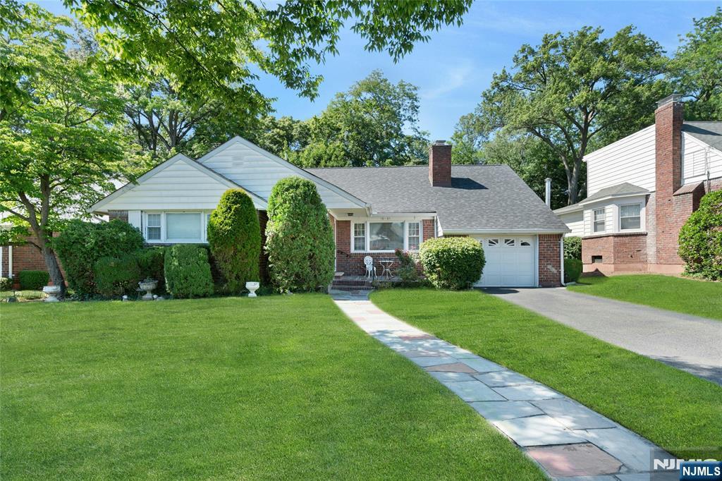 Terrific 3BR ranch nestled on a lovely residential street in Fair Lawn's desirable Lyncrest area offers the convenience of one-floor living with a spacious floor plan, including powder room off the foyer and a tiled sunroom/office with direct access to both the yard & the garage. A charming porch greets you and just beyond the foyer a generously sized living room awaits with a wood-burning fireplace flanked by attractive custom bookshelves and a large picture window that optimizes the home's southern exposure. Enjoy meal prep and casual dining in the stylish modern eat-in kitchen featuring granite countertops, handsome wood cabinetry and stainless steel appliances. The dining room is perfectly situated between the living room, kitchen and sunroom and is anchored by a window wall maximizing the view of the home's exceptional yard. A generous primary bedroom, 2 additional bedrooms and a full bathroom complete the main floor. Hardwood floors grace both living and dining rooms as well as the bedrooms. The expansive basement includes a finished tiled rec room providing great options for entertaining, office or exercise space, plus direct exit to the yard & abundant storage. Discover unparalleled tranquility in the deep private yard bordering a nature preserve, providing the perfect retreat for outdoor relaxation and enjoyment. Just 2 blocks to the Blue Ribbon elementary school w/playground & close to Fair Lawn HS, houses of worship and NJ Transit options. C/A & Newer Roof