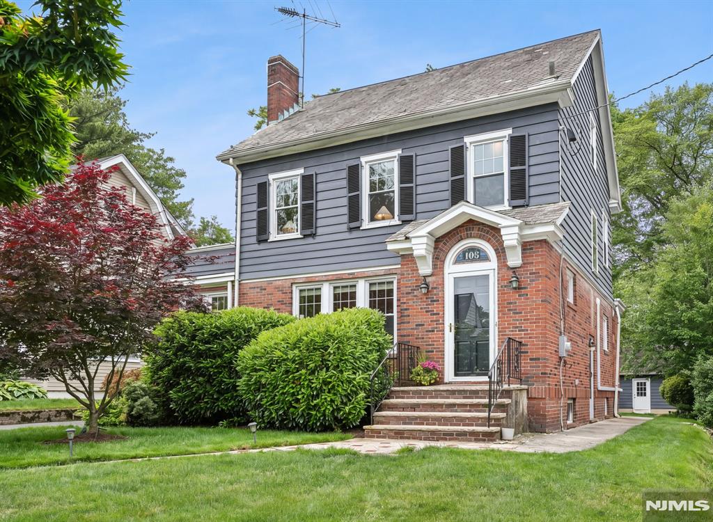 This stunning four-bedroom, two-bath home in the sought-after Tuscan section of Maplewood is the one you've been waiting for. Ribbon inlay hardwood floors, high ceilings, and original stained glass windows set the tone from the moment you walk in, timeless details that simply cannot be replicated. The wood-burning fireplace anchors the living space, while the family room with custom built-ins is perfect for everyday living and entertaining alike. A sunroom offers ideal flex space for a home office or quiet retreat, and the formal dining room is ready for every occasion. The eat-in kitchen is appointed with quartz countertops, stainless steel appliances, and a Bosch dishwasher. The updated, first-floor full bath features a marble vanity and stall shower. The second floor comprises three light-filled bedrooms and a full bath with separate tub and shower. The spacious primary bedroom opens onto a private terrace, perfect for morning coffee or a cool drink after work. The fully-finished third floor contains a charming fourth bedroom as well as plentiful storage. A large, unfinished basement is ready for your creative touch. Newer windows throughout complete this quintessential Maplewood Colonial. Step outside to a deep, flat yard with mature plantings. And with a Jitney stop right across the street connecting to the Midtown Direct train, your commute practically takes care of itself. Welcome home!