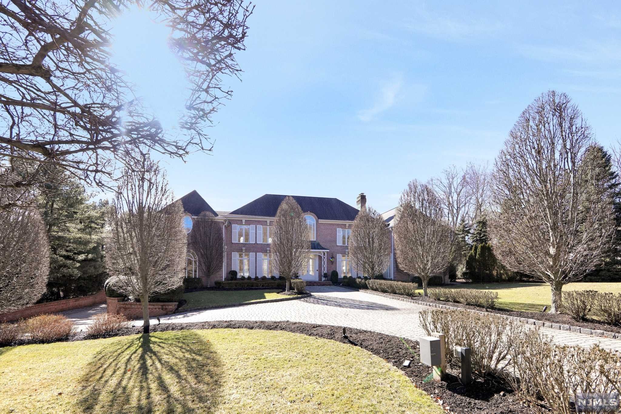 An all brick French Chateau nestled on one acre is located on a tree-lined cul-de-sac. The beautiful home was built by custom builders Commorata-Berardi and has exquisite detail with custom woodwork throughout. First floor has a beautiful billiard room and library that leads to an open finished basement. The open finished basement features a movie theater with a concession stand and a gallery that would be perfect for a play area, a gym and/or a yoga studio. The basement also has a full bathroom. The private backyard is your own oasis with custom blue stone patios, a 300 square foot pool house consisting of a full bathroom, built-in grill, central AC and heating. A 22x42 newly refurbished gunite pool is surrounded by manicured gardens and a pond. Features of the home include a sonos system, two back up generators, five car garage and a newly updated alarm system. Agent is related to the Seller.