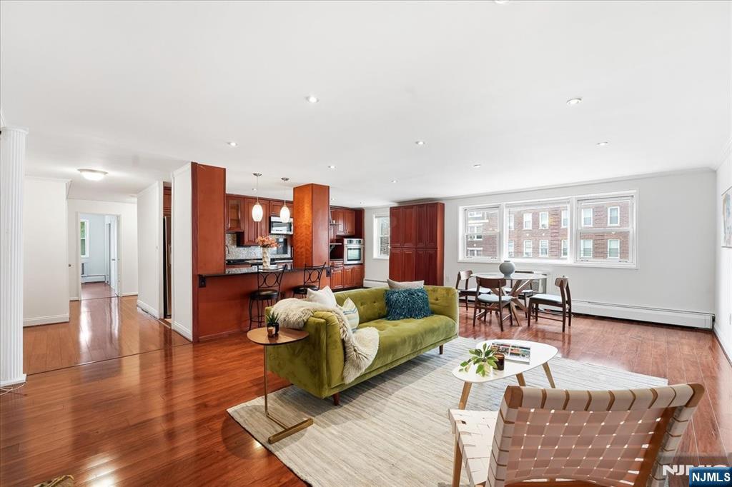 Welcome home to continuous comfort and unbeatable convenience along prestigious Boulevard East in one of Hudson Countyâ€™s premier boutique elevator buildings, Park East. This light-filled 2-bedroom, 2-bathroom residence offers over 1,200 square feet of impeccably designed open-concept living space. Large windows bathe every room in natural light, highlighting beautiful hardwood flooring and modern updates throughout. The generous kitchen features custom cabinetry, beautiful stone countertops, updated appliances, and seamless flow into a formal dining area and living room that is ideal for entertaining. Both generously sized bedrooms have partial NYC views, can easily accommodate king-size furniture and offer exceptional closet space throughout, while both full bathrooms feature clean, modern updates and stylish vanities. Building amenities include a low monthly maintenance fee, an on-site 24/7 superintendent, a laundry facility, and reserved parking available for a nominal monthly fee. Unbeatably situated steps from direct NYC bus transportation, the waterfront, light rail, and Weehawken ferry, you are within walking distance of Whole Foods, local parks, a public pool, and vibrant neighborhood dining and shopping.