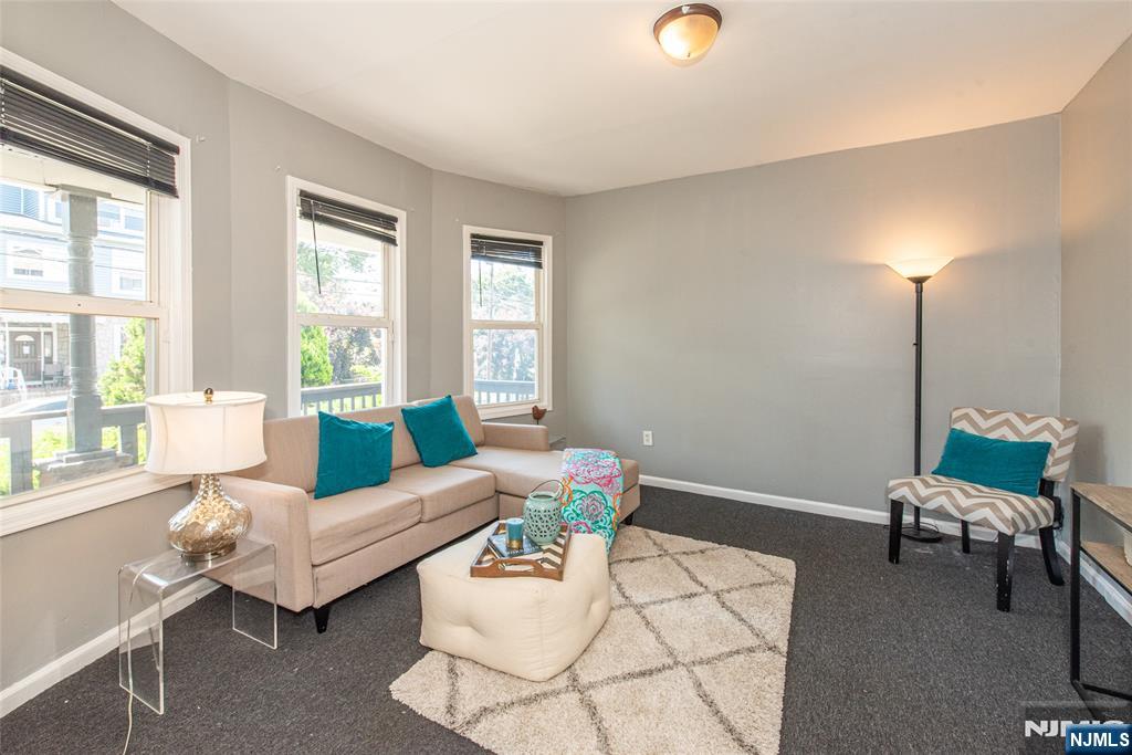 PRIME VAILSBURG LOCATION! 4-bed, 2-bath Newark single-family new to market. Sunny 1st flr delights w/ living room & dining room combo w/ bay style window, 1 big bedroom (currently used as formal dining room), renovated full bath, modern eat-in kitchen w/ stainless appliances (w/ brand new fridge), quartz countertop, plentiful cabinetry & breakfast nook (currently office) w/ washer/dryer hook up. 2nd flr features 3 bright bedrooms & remodeled second full bath. Home boasts charming front lemonade porch, private backyard ideal summer grilling, sizable unfinished basement w/ storage galore - or finish it for home office/play space/gym. Hardwood floors, high ceilings, elegant turn of the century molding, updated plumbing & electrics thru-out, ample street parking & fenced yard. Near Vailsburg Park, Seton Hall University, shops/eateries on South Orange Avenue & Springfield Ave, Lincoln Elementary School, Garden State Parkway, I-280 & Newark Liberty Airport make this a commuter's dream!
