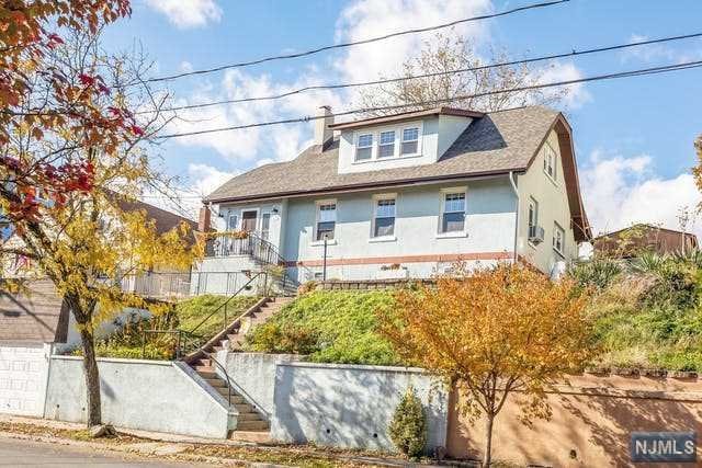 CHARMING WELL KEPT HOME PERCHED HIGH WITH NYC VIEWS IS READY FOR A NEW FAMILY. FEATURES INCLUDE ENTRY FOYER, UPDATED KITCHEN WITH GRANITE COUNTERS, WOOD BURNING FIREPLACE IN LIVING ROOM, 2 FULL BATHS, COFFERED DINING ROOM CEILING, OF 4 BEDROOMS MAIN BEDROOM WITH ADJOINING ROOM THAT IS GREAT FOR OFFICE/STORAGE/OTHER IS LOCATED ON FIRST FLOOR, GAS HEAT, ONE CAR GARAGE AND GENEROUS BACK YARD FOR OUT DOOR ENJOYMENT. EAST RUTHERFORD LOCATION IS QUICK ACCESS TO MAJOR HIGHWAYS, SHORT RIDE TO NYC AND MEADOWLANDS SPORTS COMPLEX. THIS 4 BEDROOM HOME CAN BE YOUR NEW HAPPY PLACE! CONTINGENT ON SELLER PURCHASING ANOTHER HOME. (DECOMMISSIONED/DOCUMENTED OIL TANK ON PROPERTY)