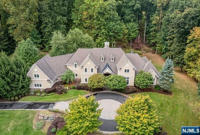 This exquisite Chester estate on one of the town's most coveted streets presents a rare opportunity to experience luxury living at its finest. The home is an architectural masterpiece, boasting high soaring ceilings and an open floor plan designed to impress. The primary suite is conveniently located on the main floor along with an additional en-suite bedroom offering convenience and versatility. Four other en-suite bedrooms are located on the second floor, two of which have large sitting rooms.The gourmet kitchen is a chef's delight, equipped with top-of-the-line appliances, granite countertops, and ample storage space. The large bedroom suites offer breathtaking views of the valley, while the beautifully landscaped grounds provide a serene and tranquil environment for relaxation and entertaining. Custom trim work, hardwood, and tile flooring add to the home's elegance, providing a luxurious living space that is both comfortable and sophisticated. This home sits on 3.6 acres wit