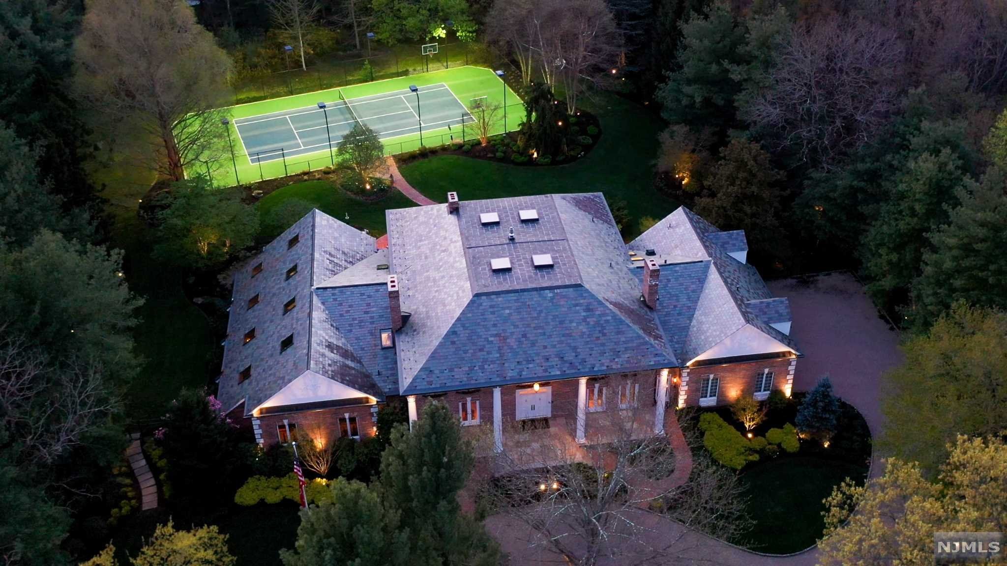 SERENE, ELEGANT RESORT LIVING ON MANICURED 2+ ACRE ESTATE ON CUL DE SAC W/ LIGHTED TENNIS & BASKETBALL CT W/STUNNING BLACK BOTTOM GUNITE INDOOR POOL & SUNROOM. UPGRADED ARCHITECTURAL FEATURES ACCENT PALATIAL GEORGIAN COLONIAL. MARBLE FOYER W/BRIDAL STAIRCASE, BORGHESE CEILING. PETER SALERNO KITCHEN W/ CHERRY CABINETS, GRANITE, & SUBZERO/WOLF APPLIANCES. 2-STORY FRANK LLOYD WRIGHT STYLE MAHOGANY GREAT ROOM W/ 2ND FLOOR ART GALLERY. OWNER'S SUITE FEAT. STUNNING CROTCH MAHOGANY STUDY & SITTING AREA OVERLOOKING POOL W/ACCESS. 4 ADD'L BEDROOMS (3 EN SUITE). STUNNING STAINED GLASS WINDOW ACCENTS T/O; JOE BROWN ARTWORK ADORNS CEILINGS & WALLS, ETC. PREMIUM OAK HARDWOOD FLOOR T/O. SOUND-PROOF ARTIST/SOUND STUDIO.SAVANT WHOLE HOUSE AUDIO/VIDEO/SECURITY SYS INCL LUTRON LIGHTING; HVAC & HUMIDITY CONTROL SYSTEM T/O HOUSE (8 ZONES); KOHLER BACK-UP GENERATOR (50KW); 5 FPL'S EXPANSIVE TERRACE W/ BUILT-IN GRILL & FRIDGE. SPECIMEN/MATURE PLANTINGS ON LUSH PRIVATE GROUNDS. IMMACULATE 4-CAR GARAGE.