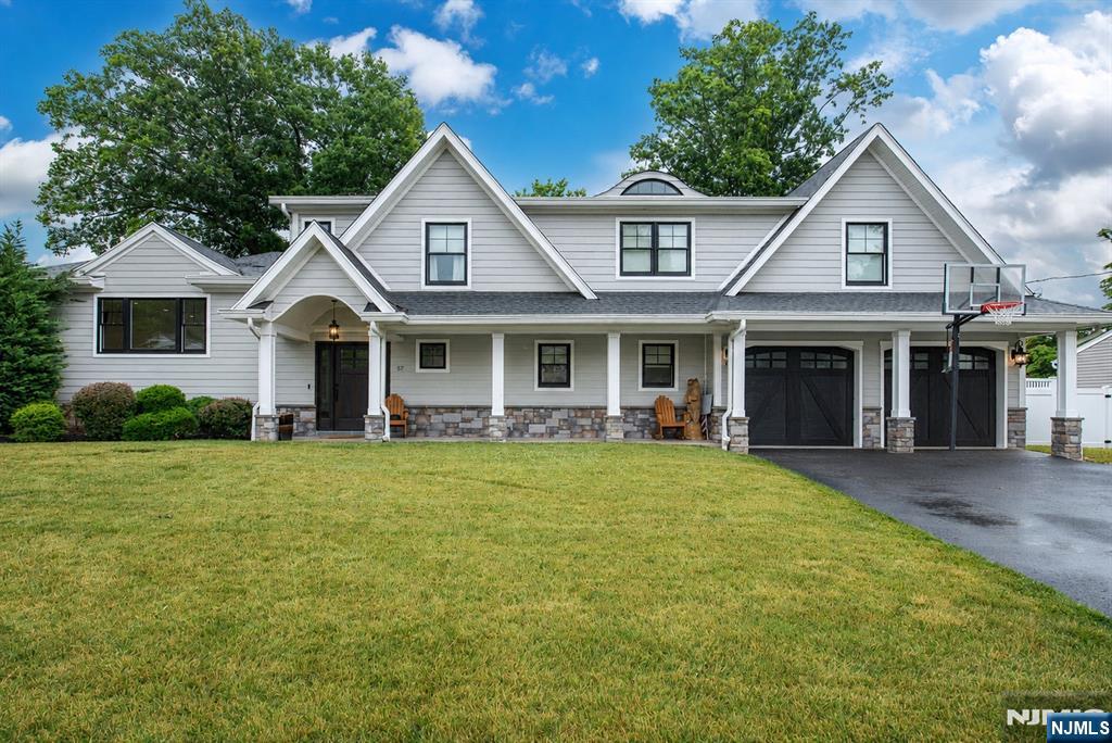 Welcome home to this stunning, completely updated split-level that perfectly balances modern luxury with everyday functionality. From the moment you step inside, you'll be greeted by an incredibly bright and open-concept living space designed for seamless flow and effortless entertaining. The heart of the home is the chef-inspired kitchen, boasting gleaming quartzite countertops with a matching quartzite backsplash, stainless steel appliances, and premium finishes. Whether you're hosting a casual weeknight dinner or a weekend gathering, this open space keeps you connected to your guests. Retreat to the upper level, where you'll find all the home's bedrooms clustered together for ultimate privacy and convenience. The expansive primary suite serves as your personal sanctuary, complete with a generous walk-in closet and a beautifully updated en suite bathroom. For maximum convenience, this level features a dedicated upper-level laundry area, one of two laundry setups in the home. Step outside into your private backyard paradise. The beautifully maintained property features a sparkling swimming pool and a built-in outdoor kitchen area, making it the ultimate summer hangout spot for barbecues and poolside lounging.